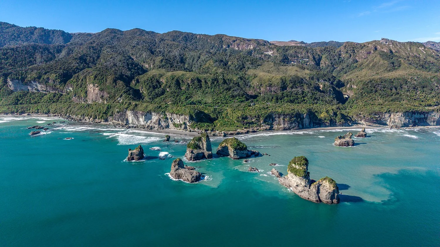 Aerial view of Motukiekie sea stacks and West Coast shoreline.