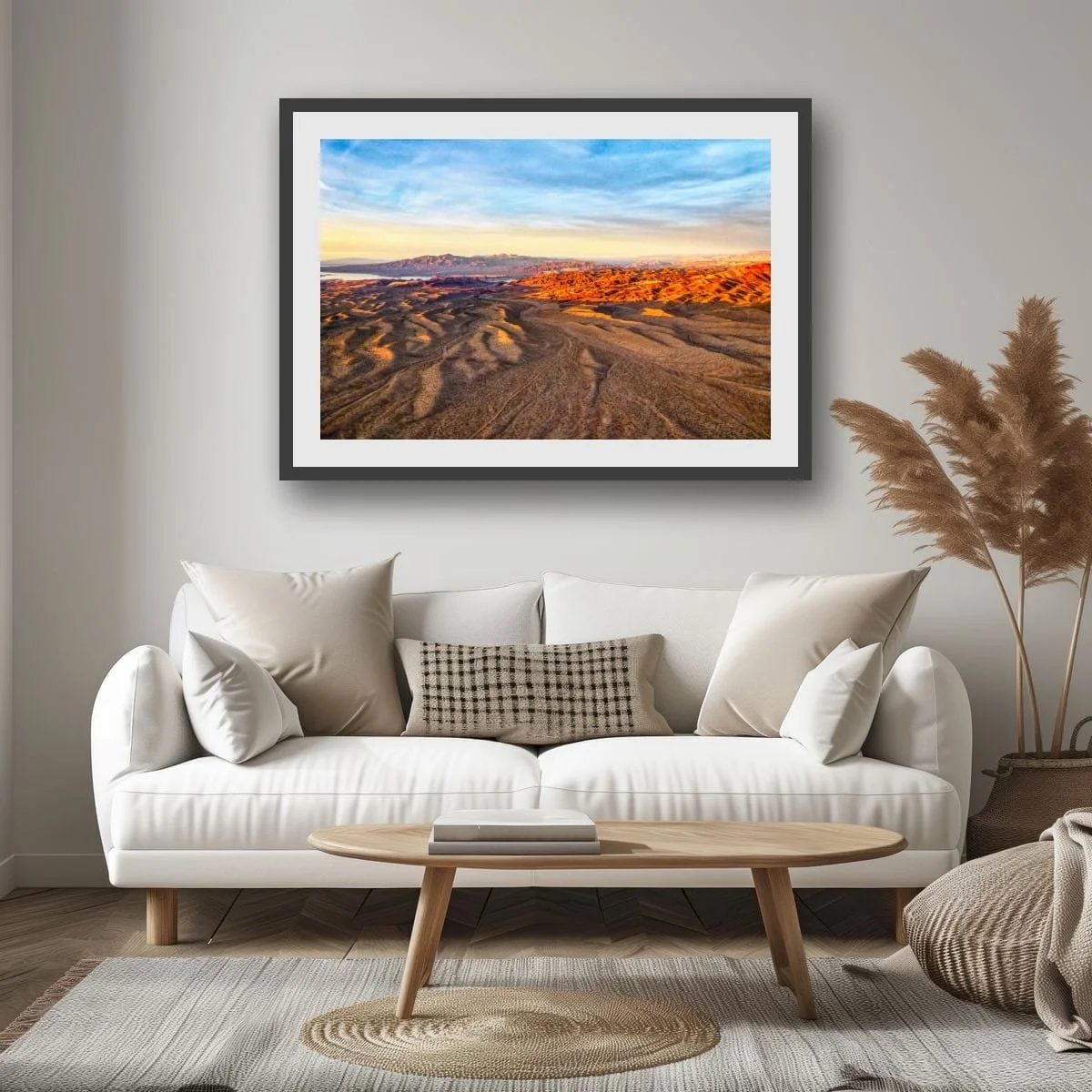 Aerial view of flowing desert ridges and mountains.