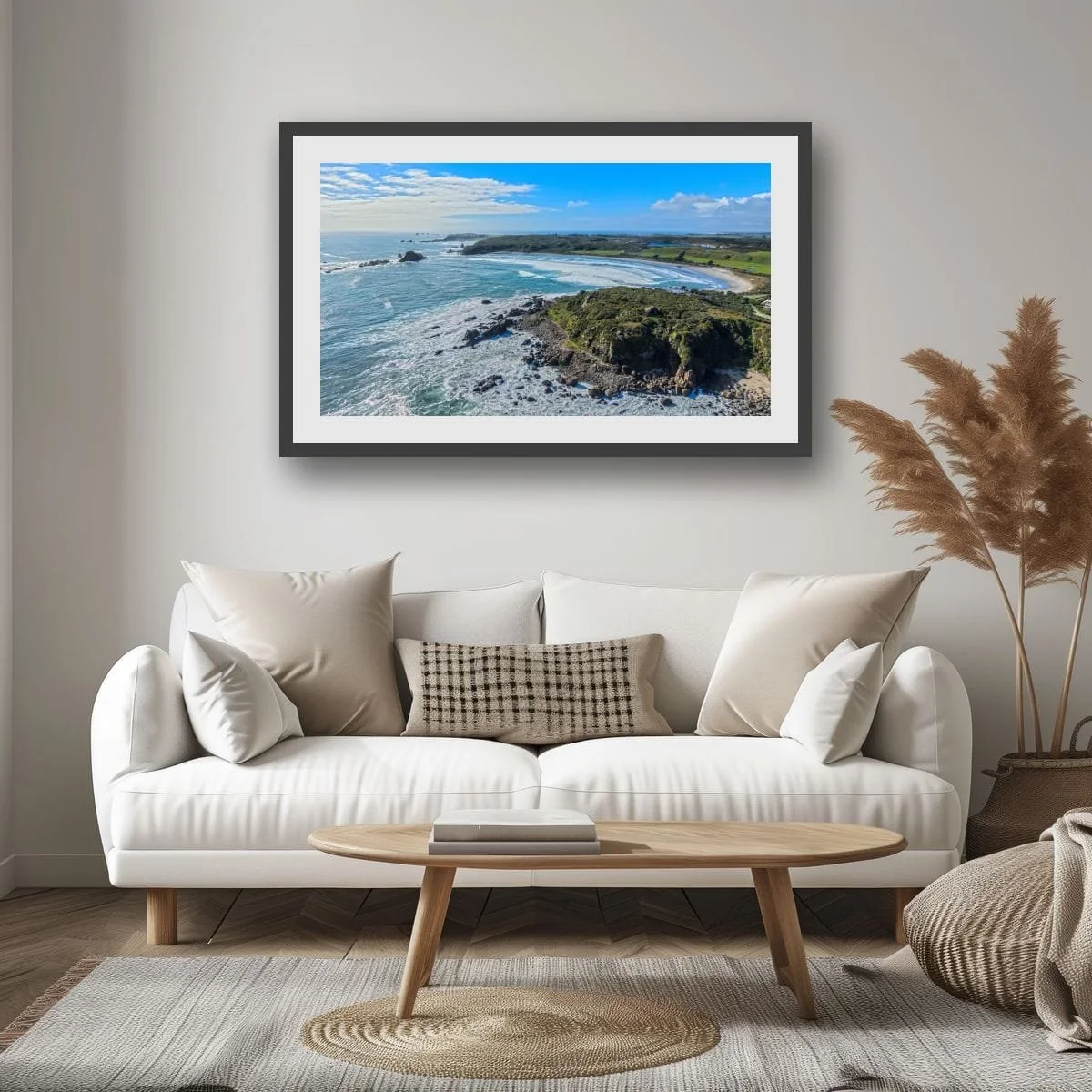 Waves rolling onto a West Coast beach with sea stacks offshore.