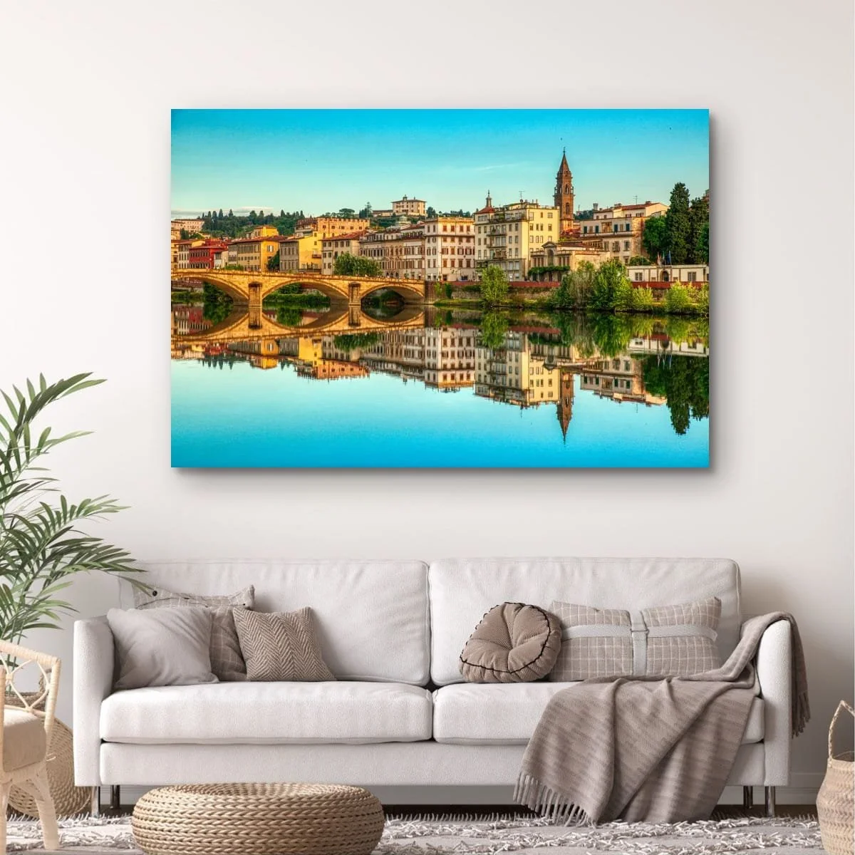 Florence skyline reflected in the Arno River at sunset.