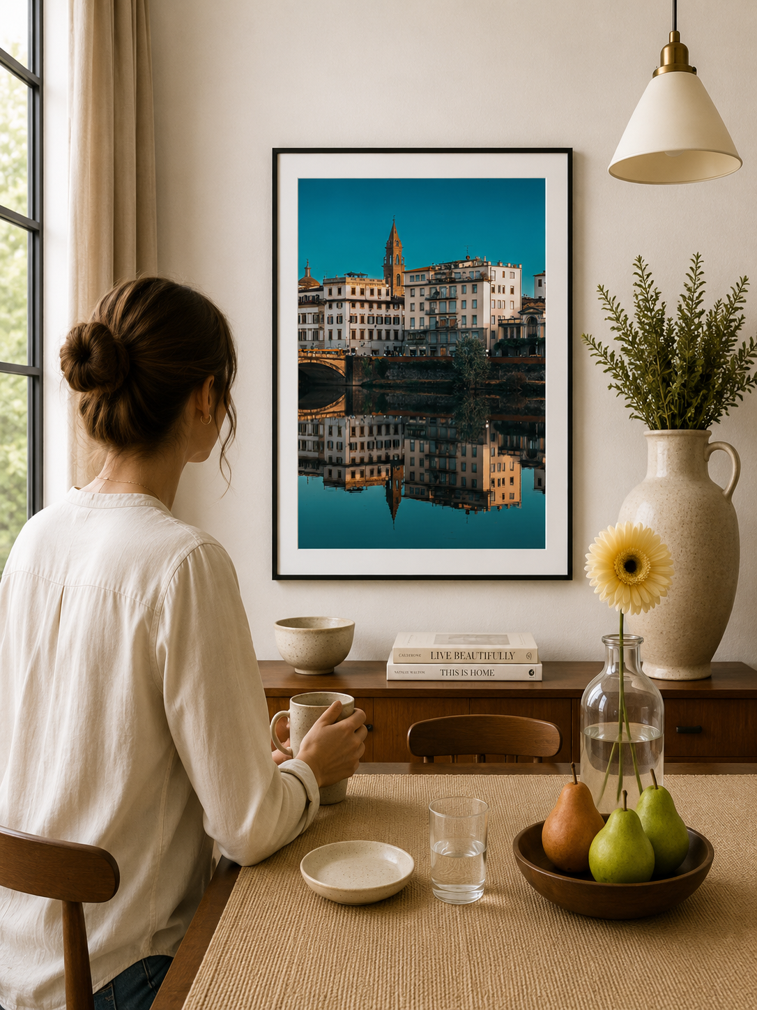 Tuscan buildings and church reflected in calm water.