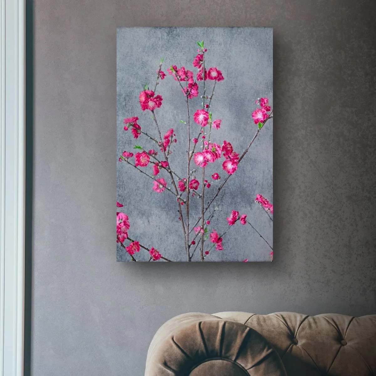 Bright pink blossom branches against a textured backdrop.