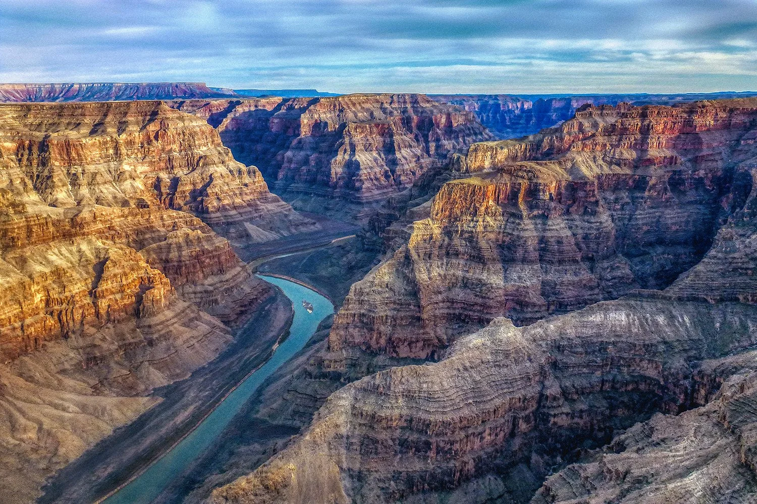Grand Canyon landscape with winding river below.