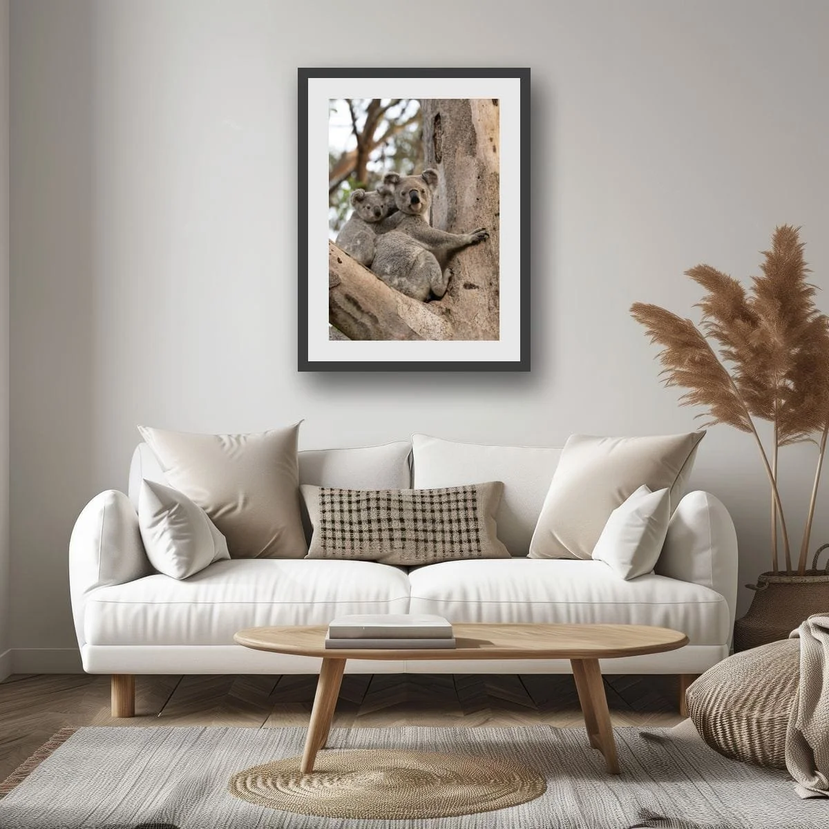 Mother koala with joey in a eucalyptus tree