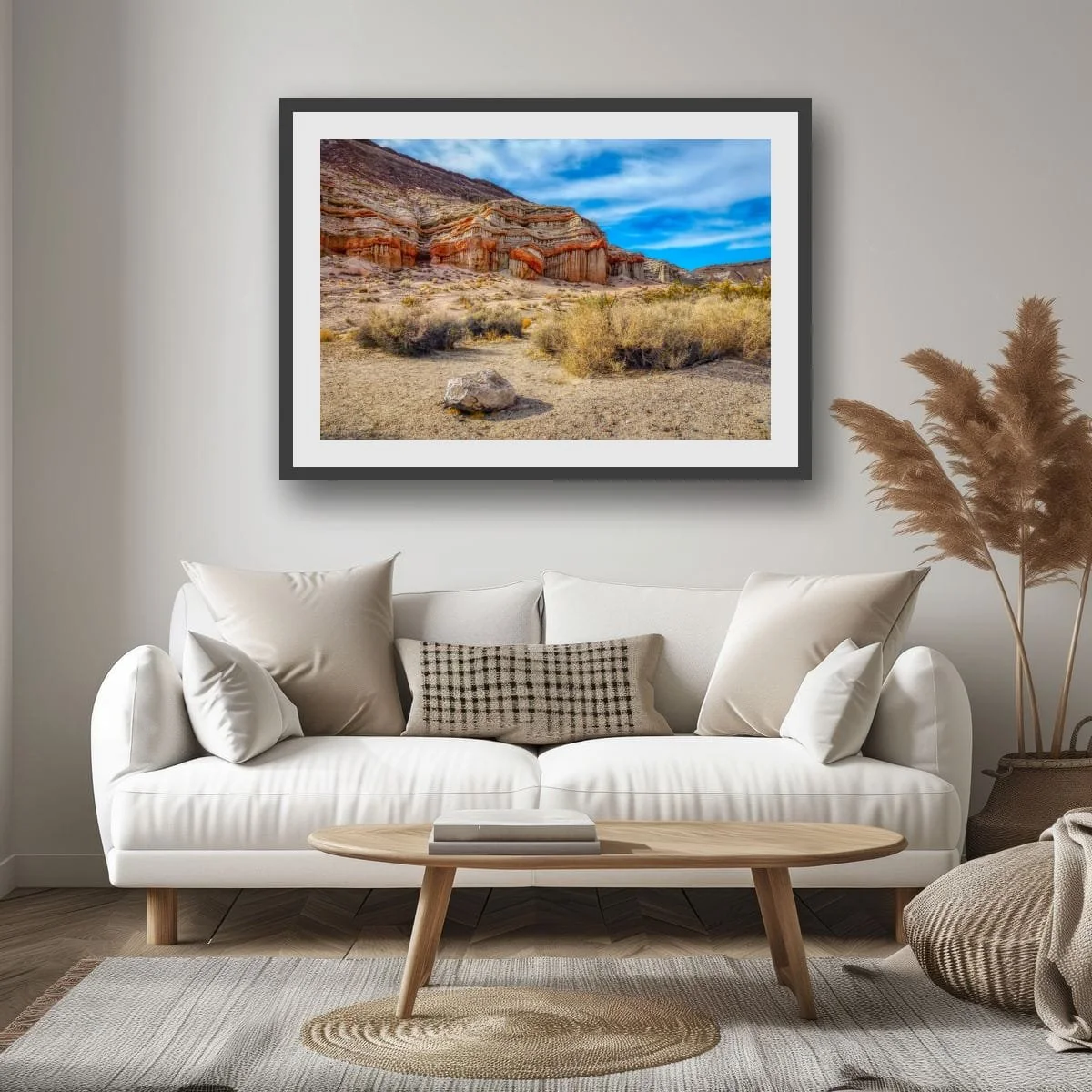 Layered desert rock formations in the Mojave Desert landscape.