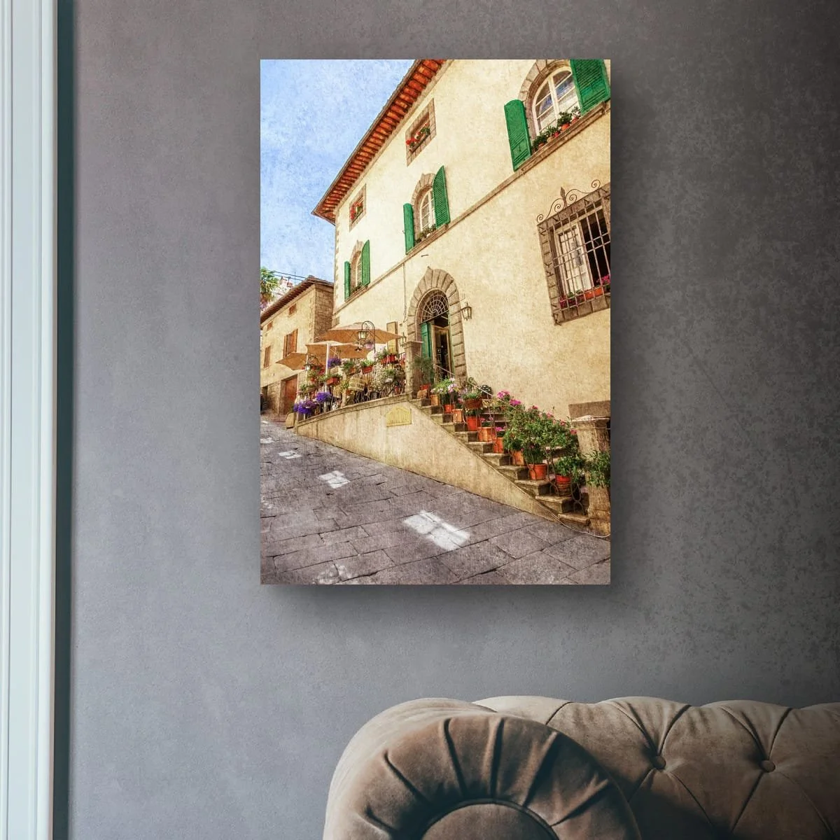 Italian building entrance with flowers, shutters and stone architecture.