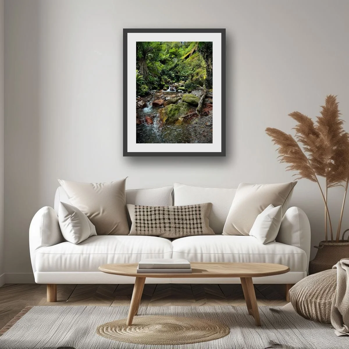 Native forest stream flowing through mossy rocks and ferns.