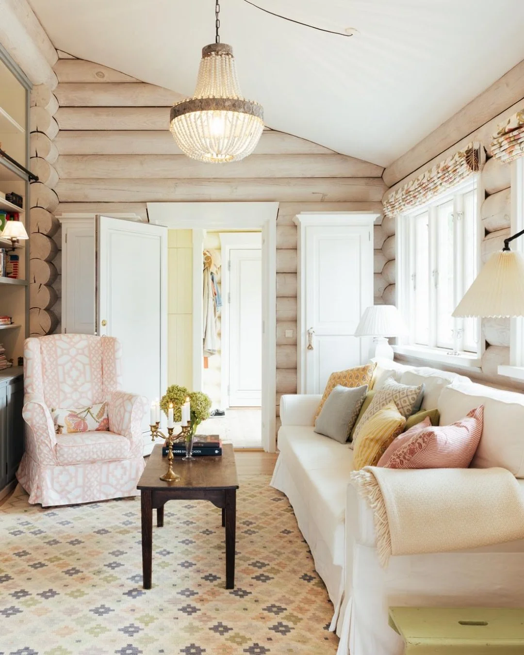 This 1960s log cabin on the Danish coast had passed to the next generation of the same family, and with it, a brief - how to honour what was already there while making it work for the way they live now. We were brought in to reconfigure the layout, d