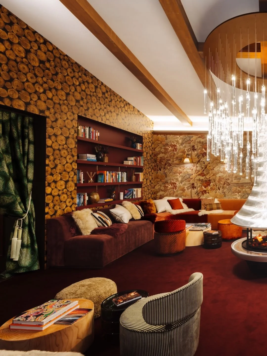 Passing through the bar and dining club, curtains softened the way, guests arrived at the fireplace - the chalet&rsquo;s heart and centre. Everything else arranged itself around it. 

I wanted a fire that draws visitors in its spell , suspended and s