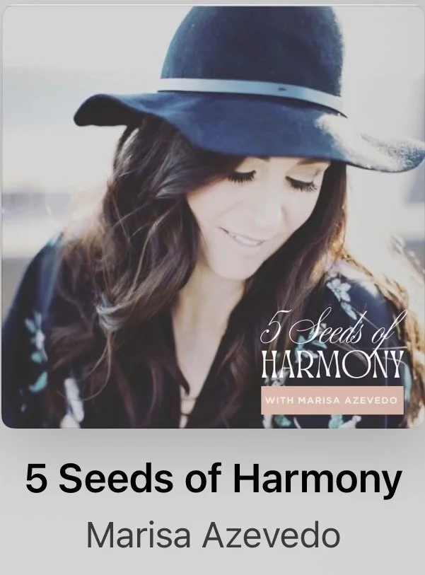 Book cover titled '5 Seeds of Harmony' by Marisa Azevedo, featuring a woman with long brown hair wearing a dark hat with a white band and a floral blouse, smiling and looking down.