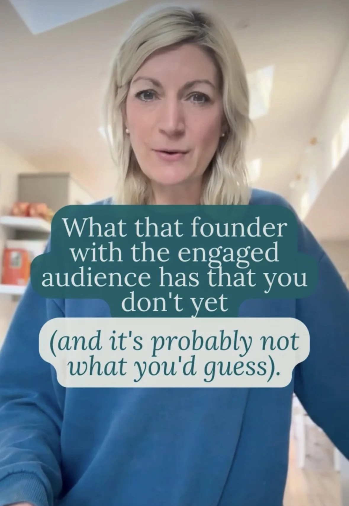 A woman with blonde hair wearing a blue top speaking indoors with caption overlay that reads, 'What that founder with the engaged audience has that you don't yet (and it's probably not what you'd guess).'