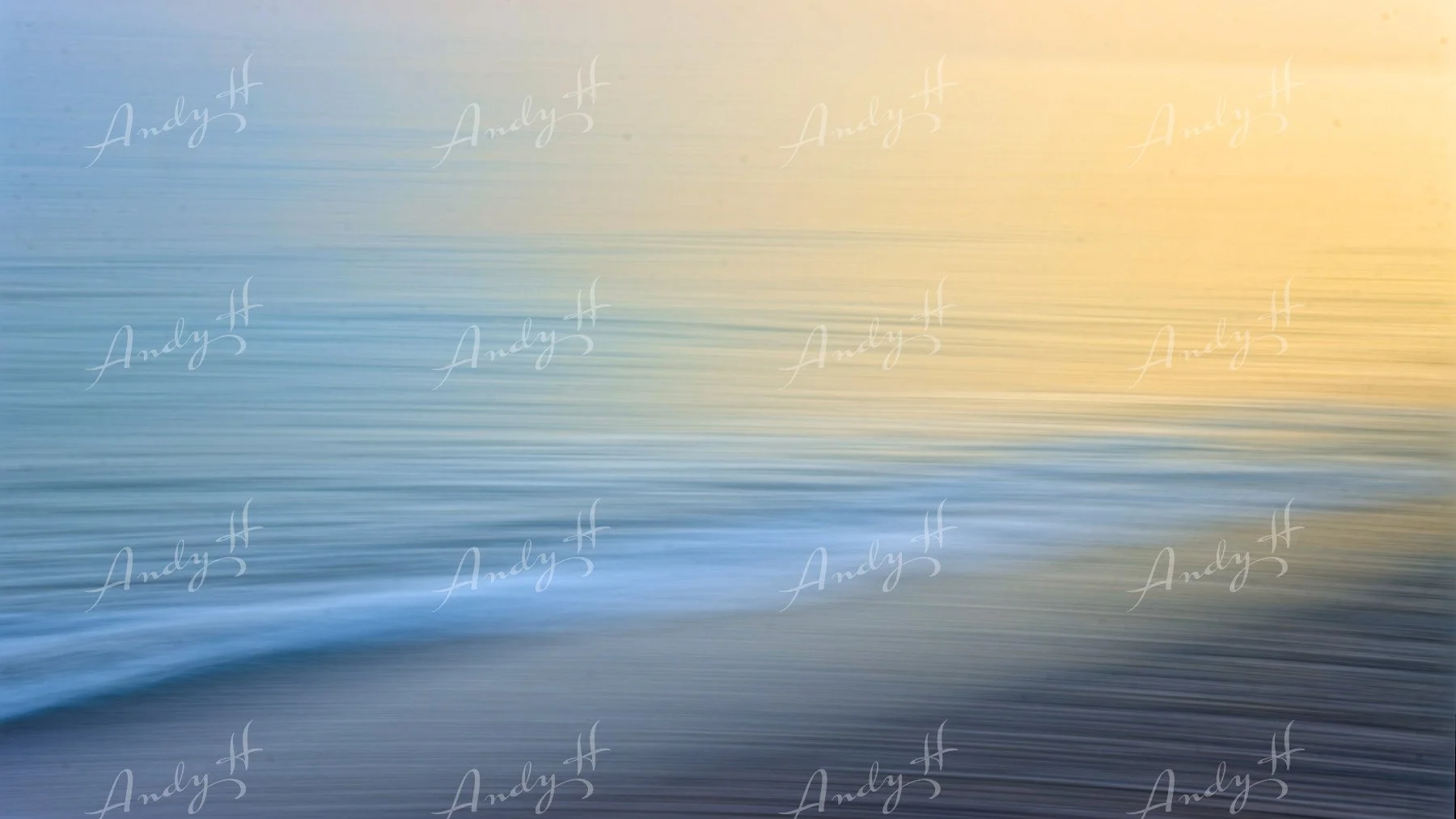 An abstract fine art print, of water with peaceful ripples at sunset or sunrise, with soft pastel colors in the sky.