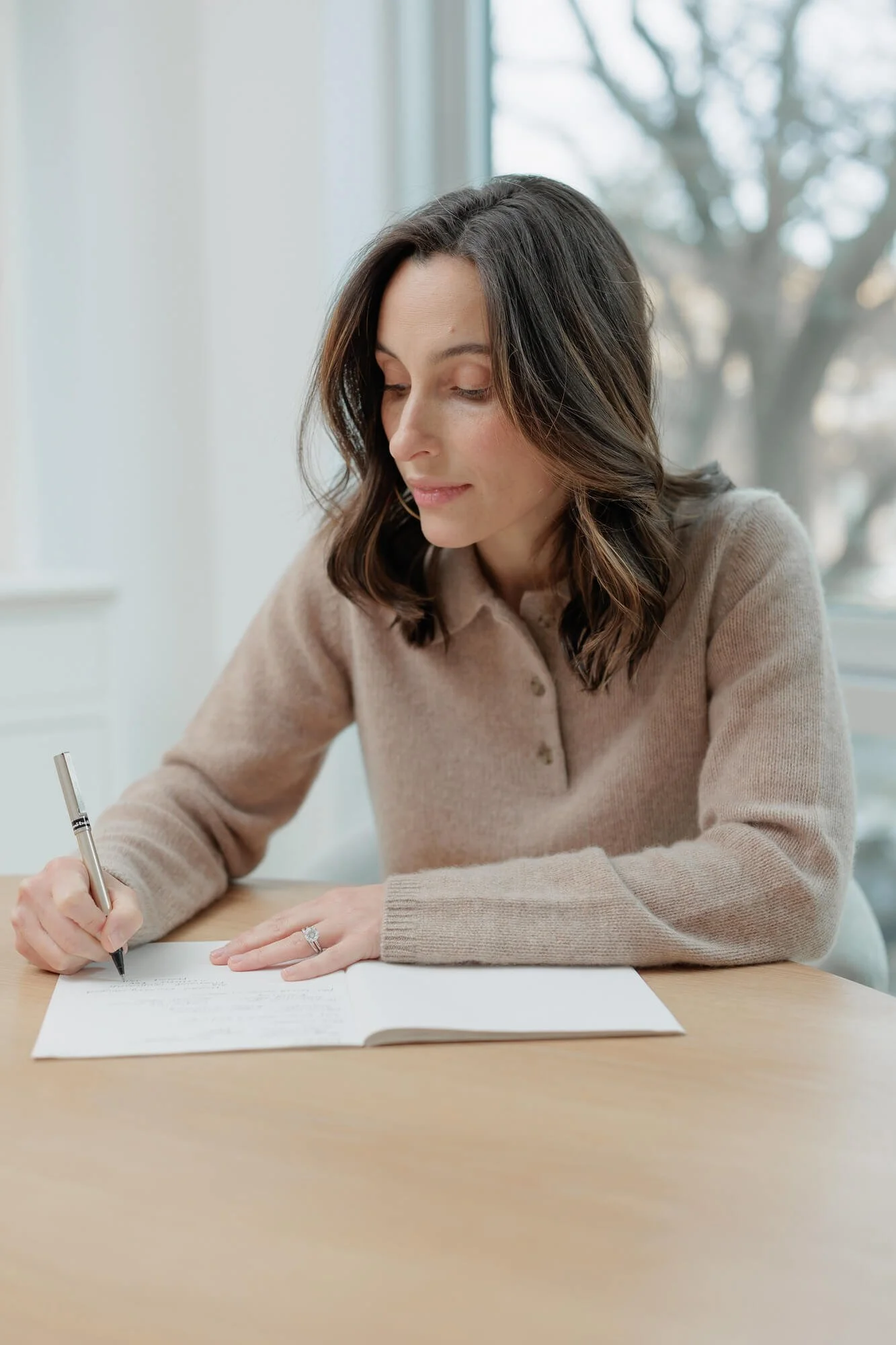 Alissa Friedlander, LCSW - writing in notebook