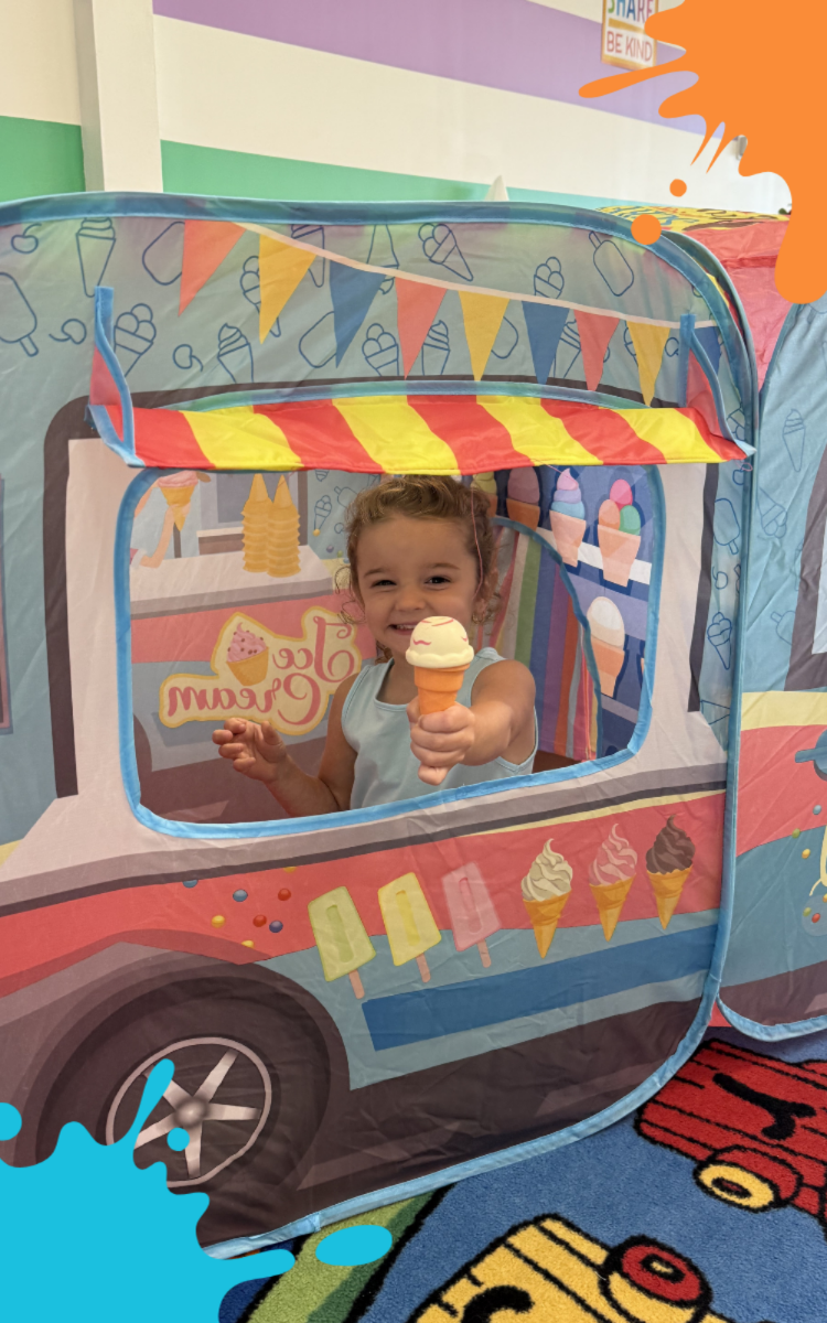 Toddler exploring a themed activity at Kid Ka Doodle in Flemington, NJ.