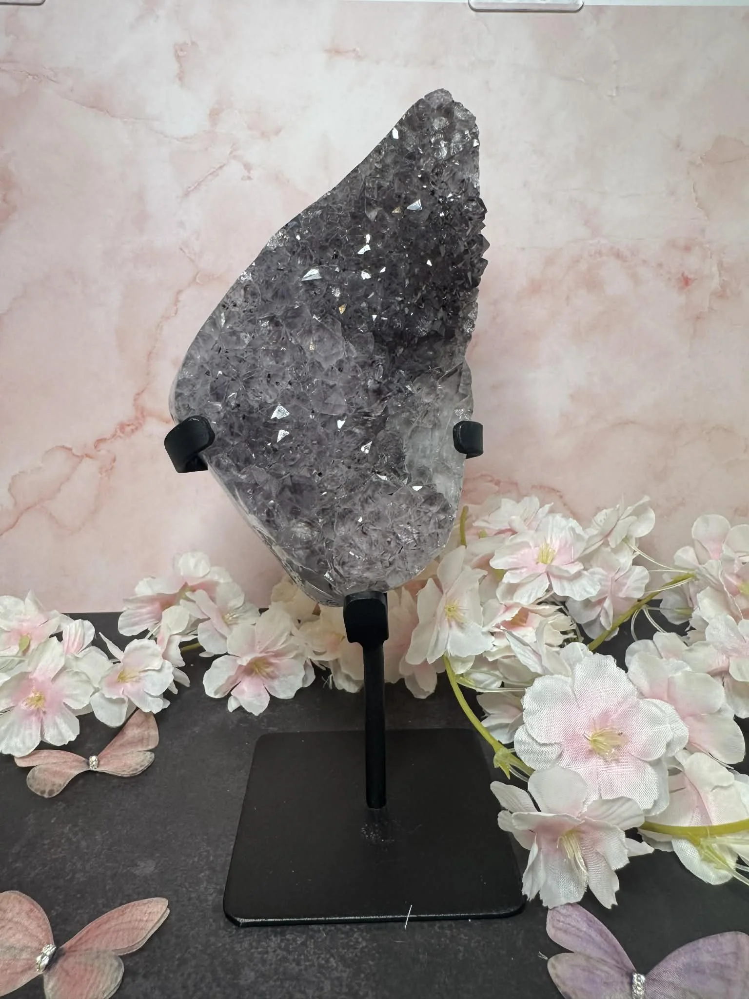 Purple amethyst cluster on stand