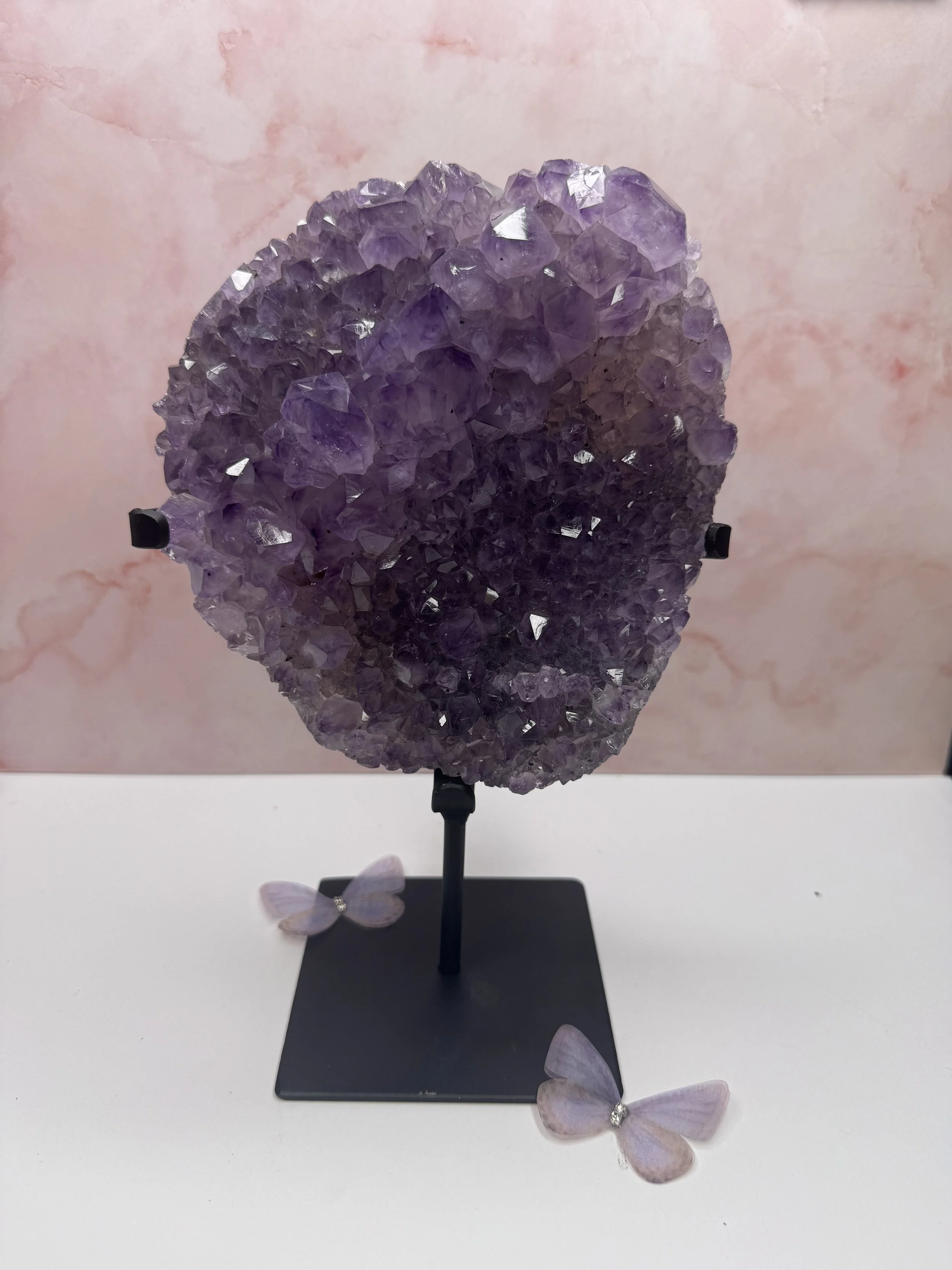 Purple amethyst cluster on stand