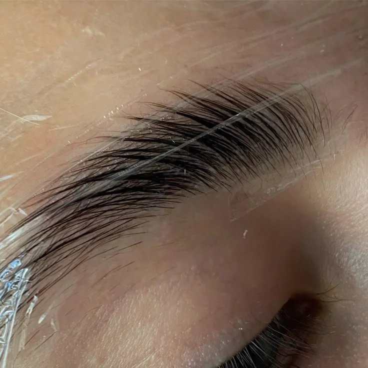 Close-up of eyebrow undergoing a brow lamination procedure