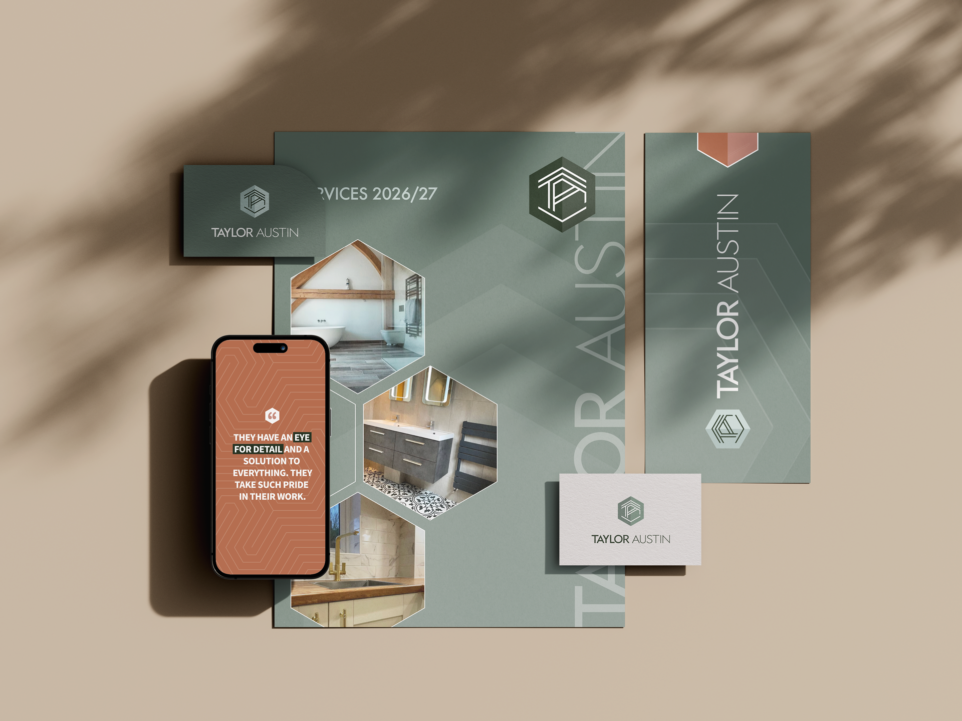 Brochures and a smartphone on a beige background displaying interior design images and a quote from Taylor Austin.