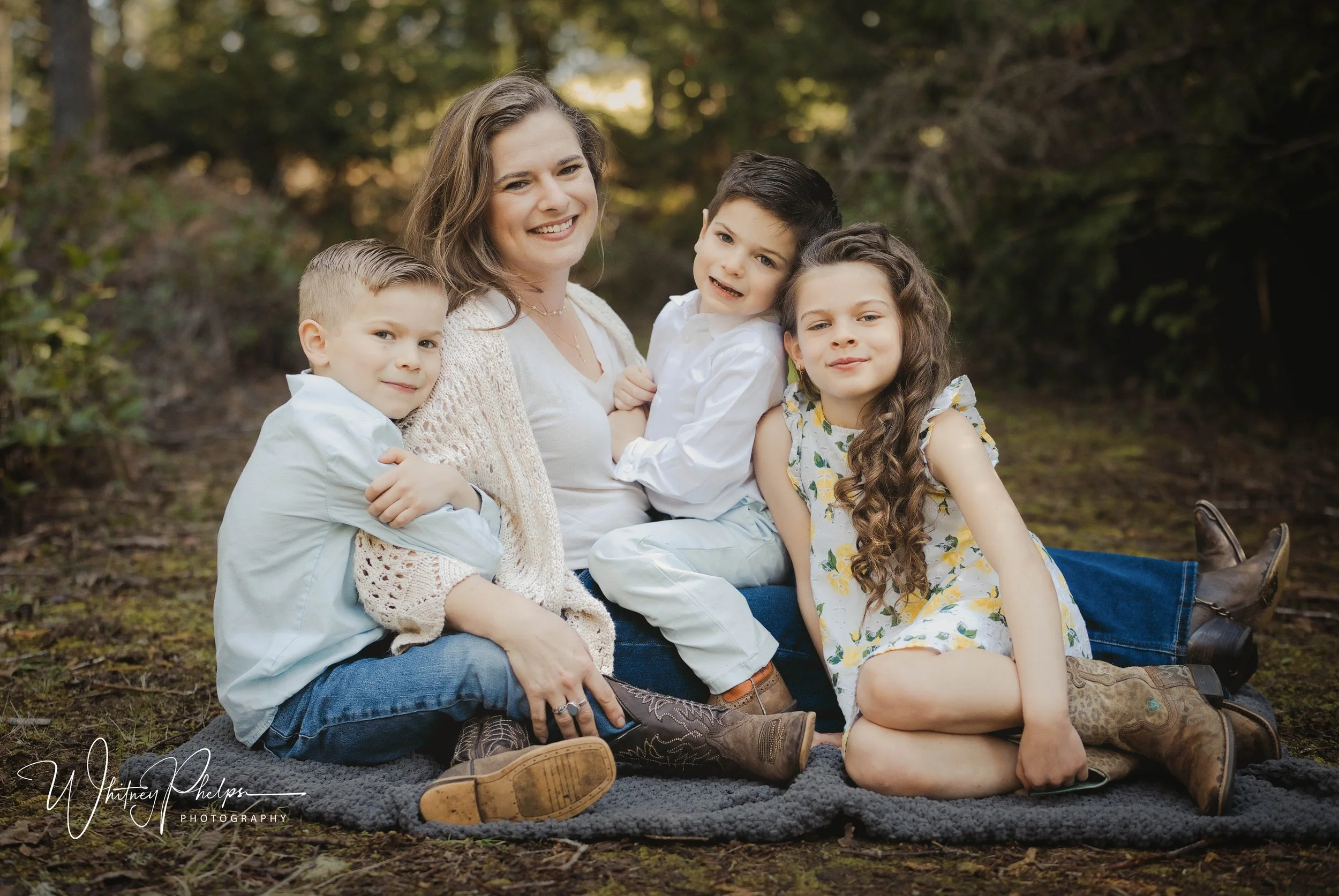 Family portrait among evergreen trees in the Pacific Northwest McCormick Woods Port Orchard WA