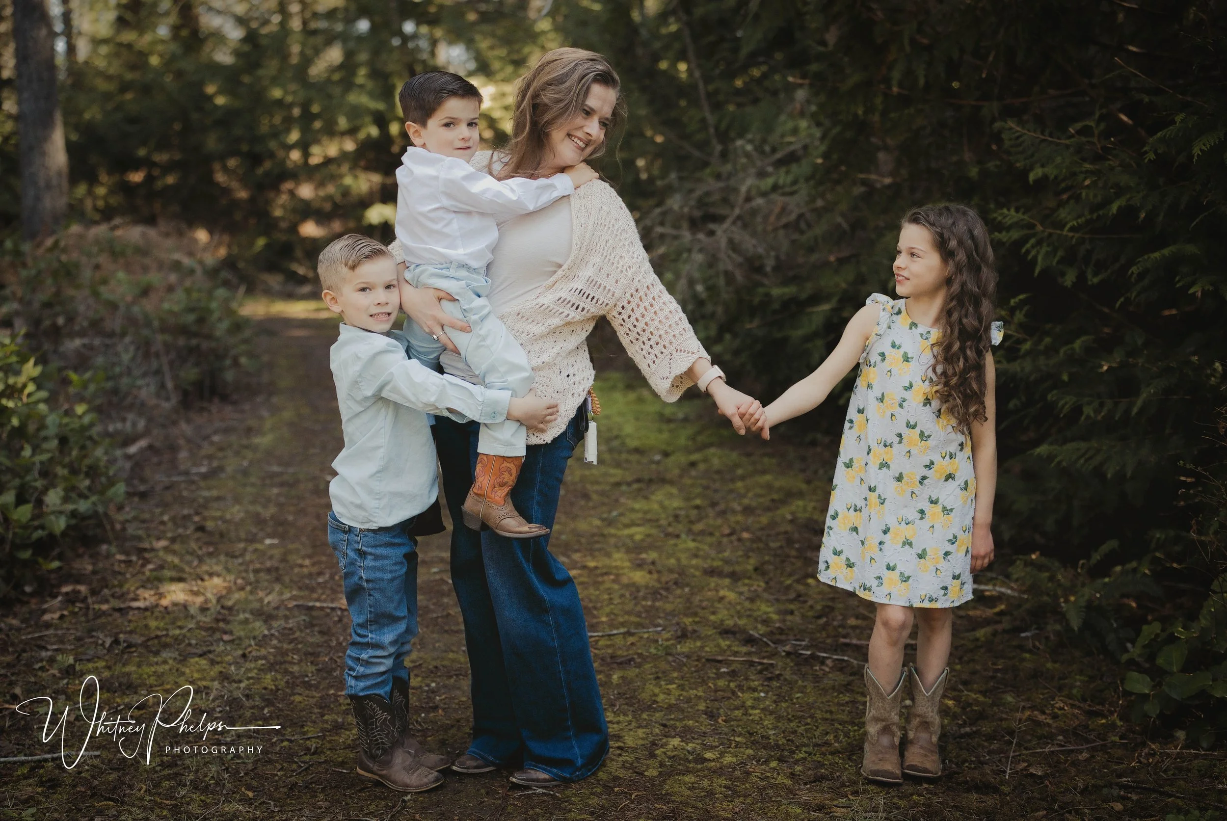 Mother and children sharing a sweet moment in an outdoor family portrait Pacific Northwest