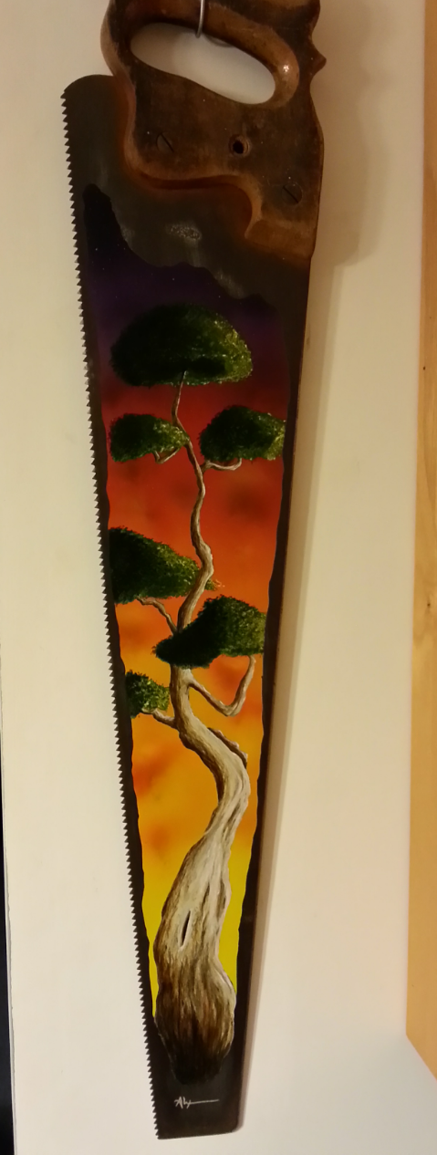 A hand-painted saw with a landscape of a twisted tree with green foliage against a colorful sky background.