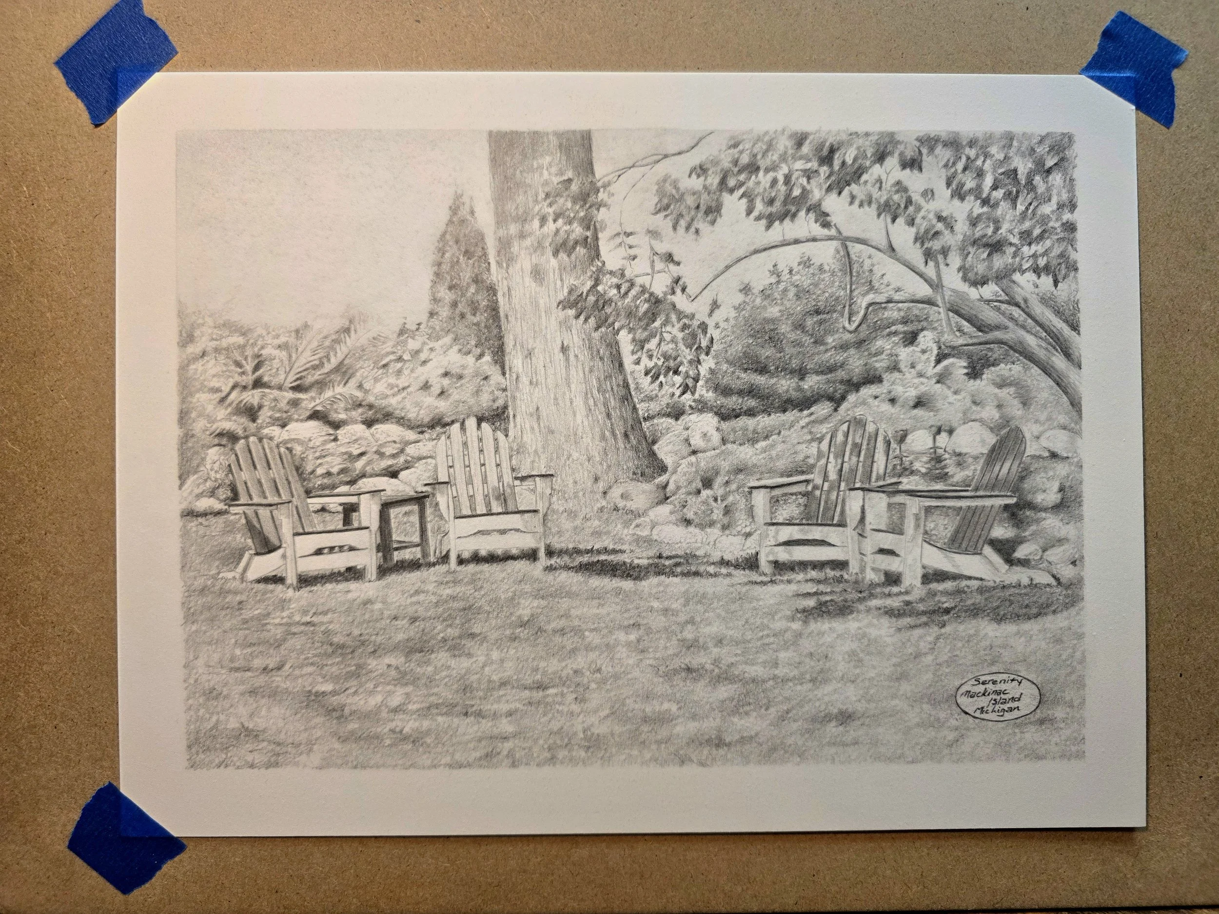A detailed pencil drawing of a woodland scene with large trees, bushes, rocks, and five Adirondack chairs on a grassy area. Based on a picture taken by the artist