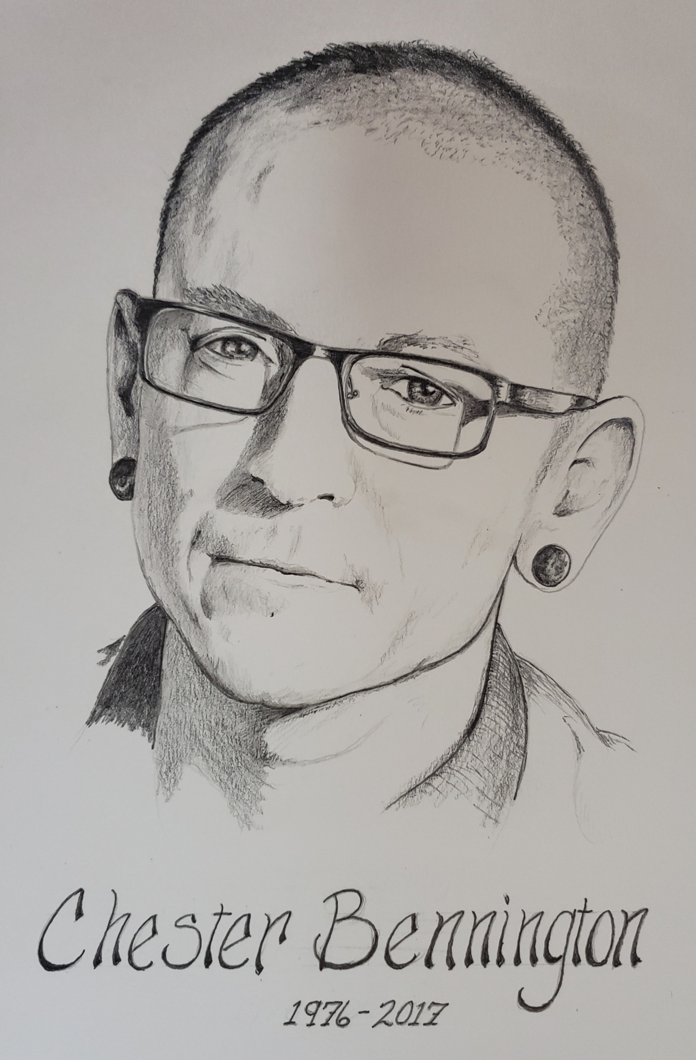 A black and white portrait illustration of Chester Bennington, with short hair, glasses and an earring. Beneath the portrait, the text reads: 'Chester Bennington 1976-2017'.