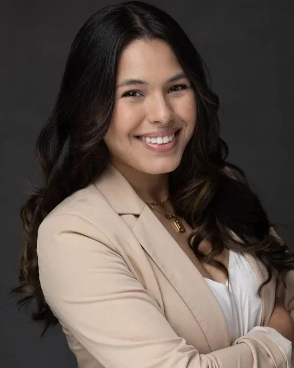 Professional corporate headshot of businesswoman in Amarillo Texas wearing a beige blazer and smiling confidently