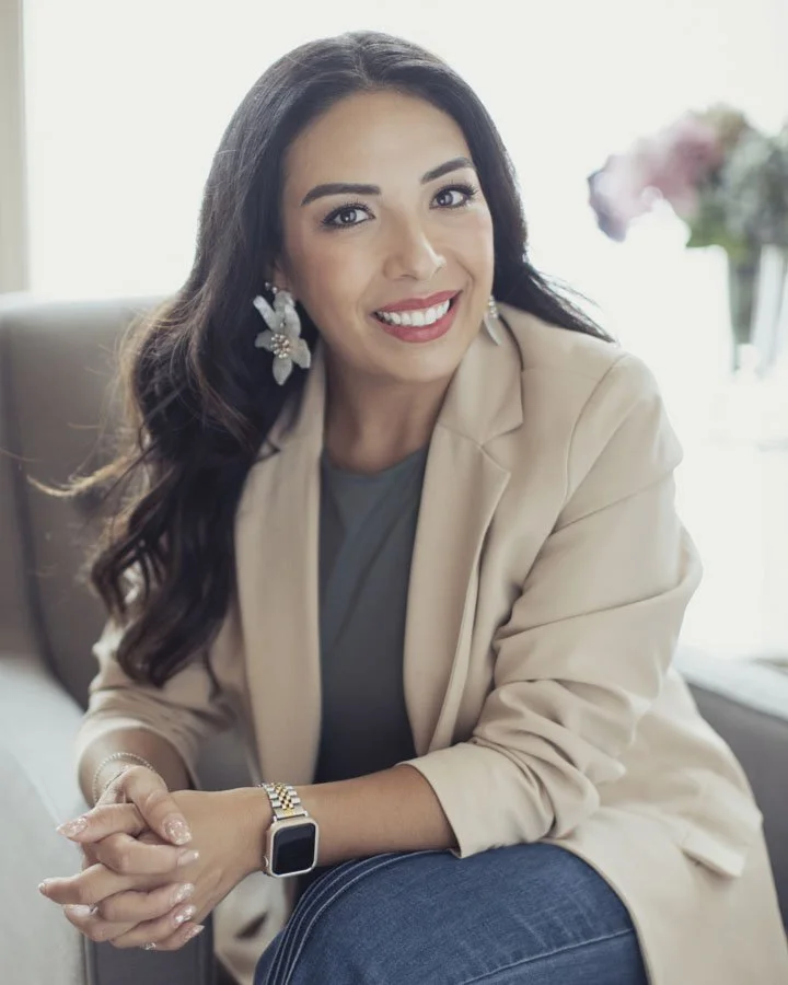 Personal branding headshot of female entrepreneur in Amarillo Texas seated in a relaxed professional setting