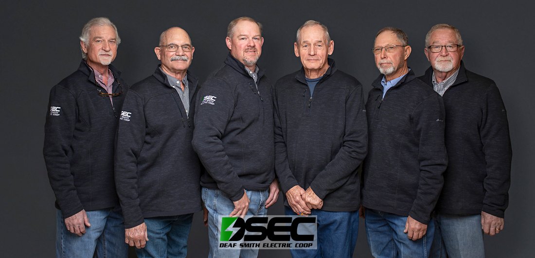 Large corporate team group photograph captured during company meeting.