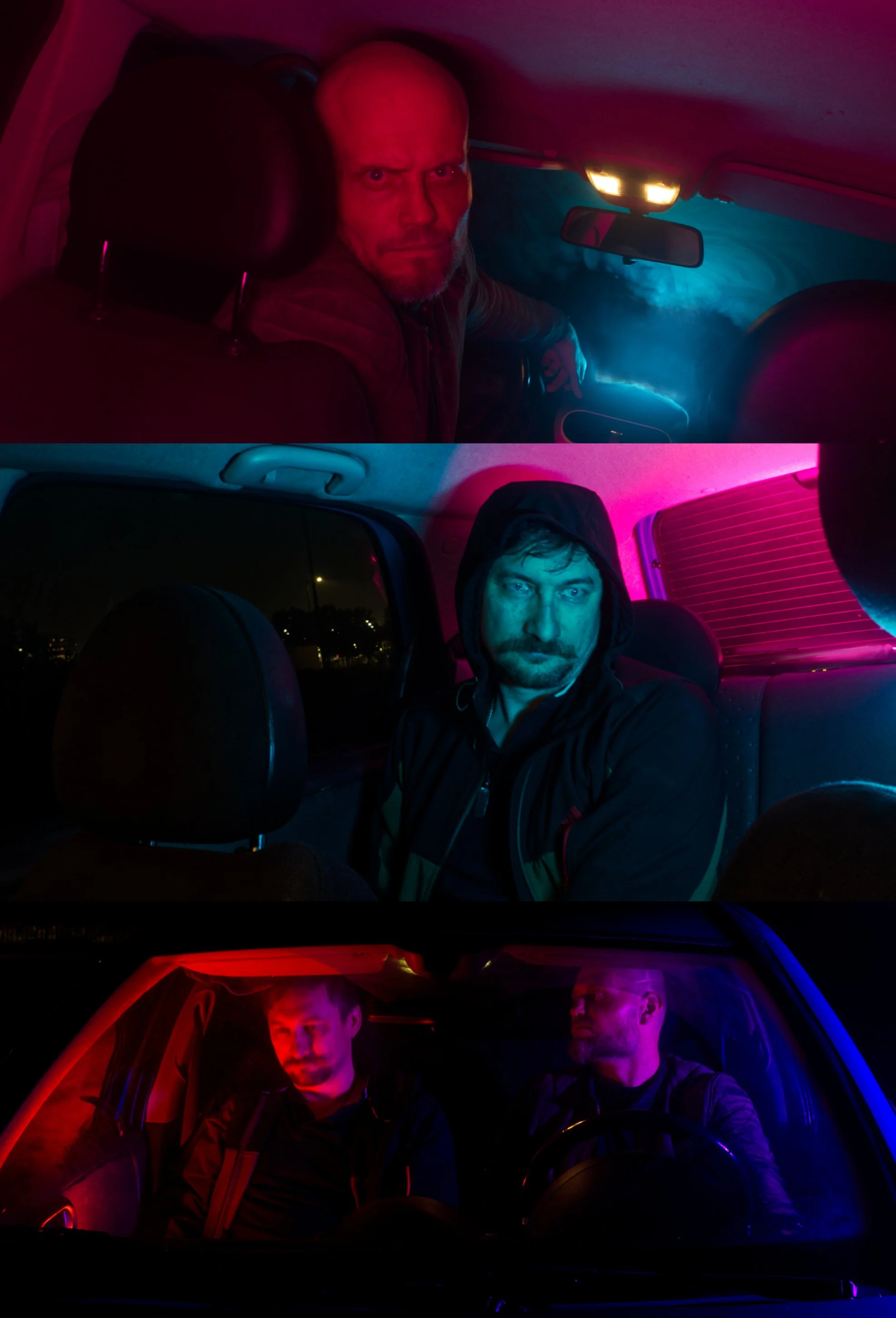 Three men sitting in cars at night with colorful, neon-like lighting inside the vehicles.