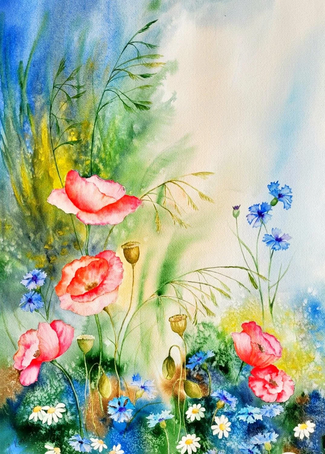 Watercolor painting of various wildflowers including poppies, cornflowers, daisies, and grasses, with a soft pastel background.