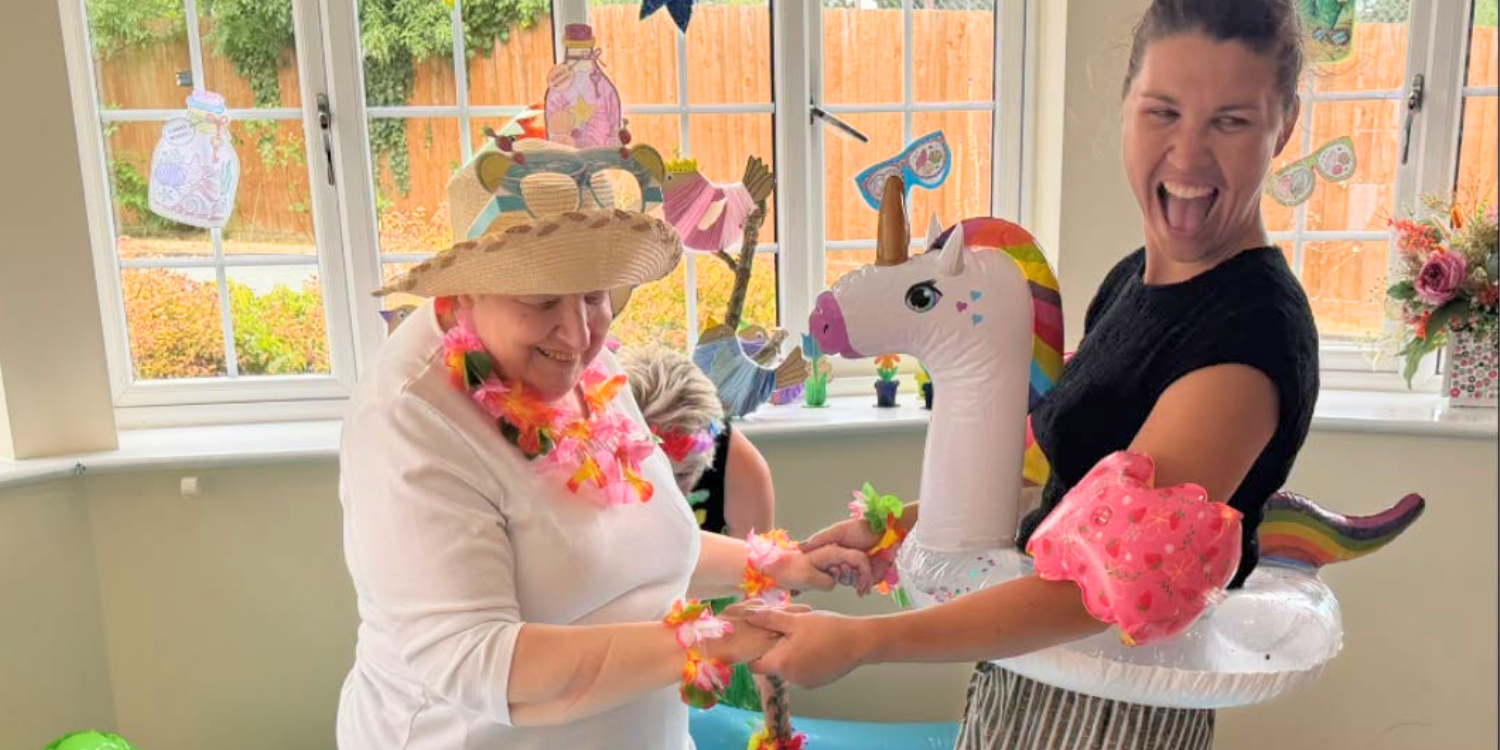 Care team member and resident enjoying a beach day at St Nicholas House care Home