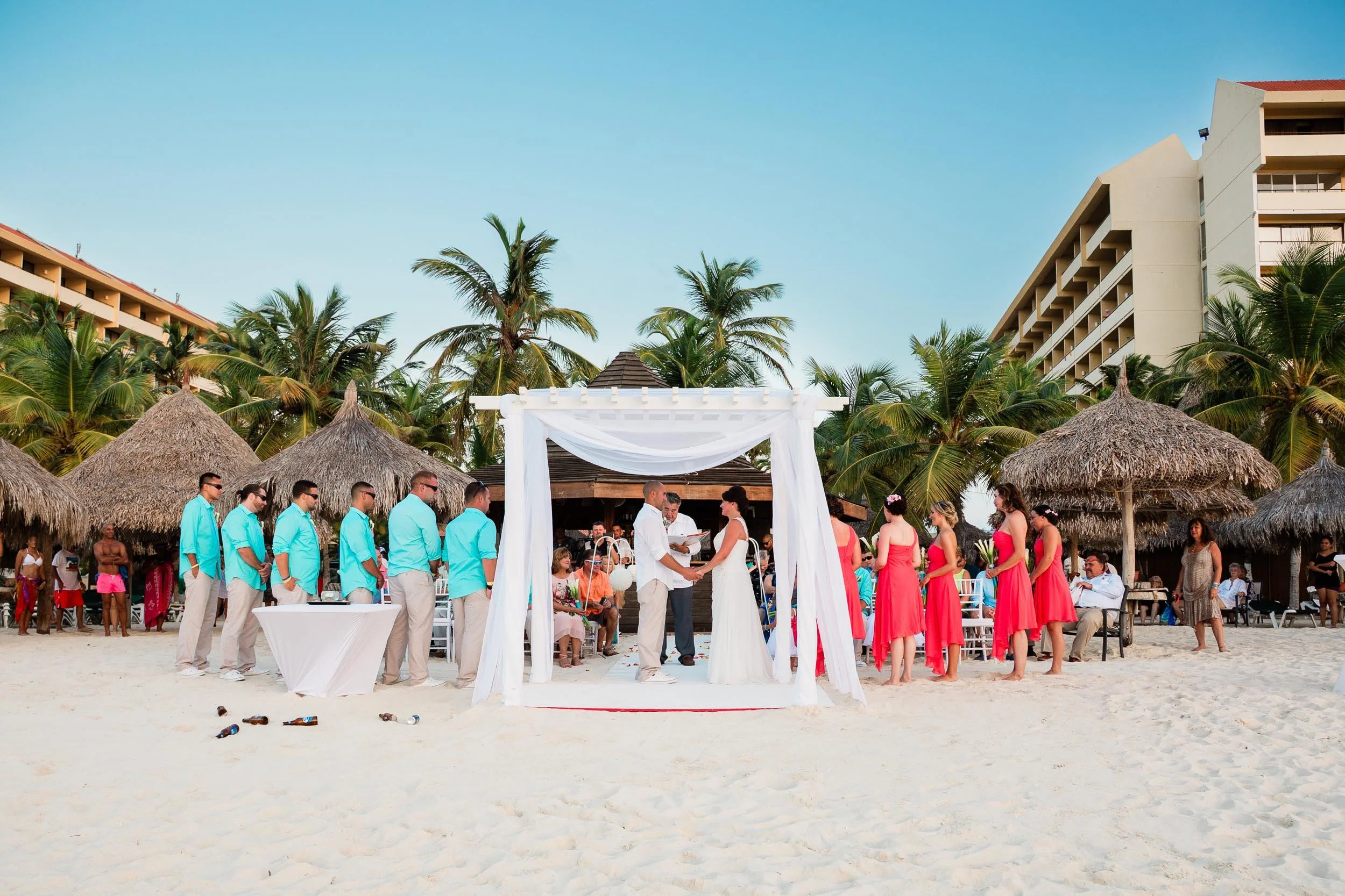 Intimate beach wedding ceremony at Palm Beach Aruba at sunset
