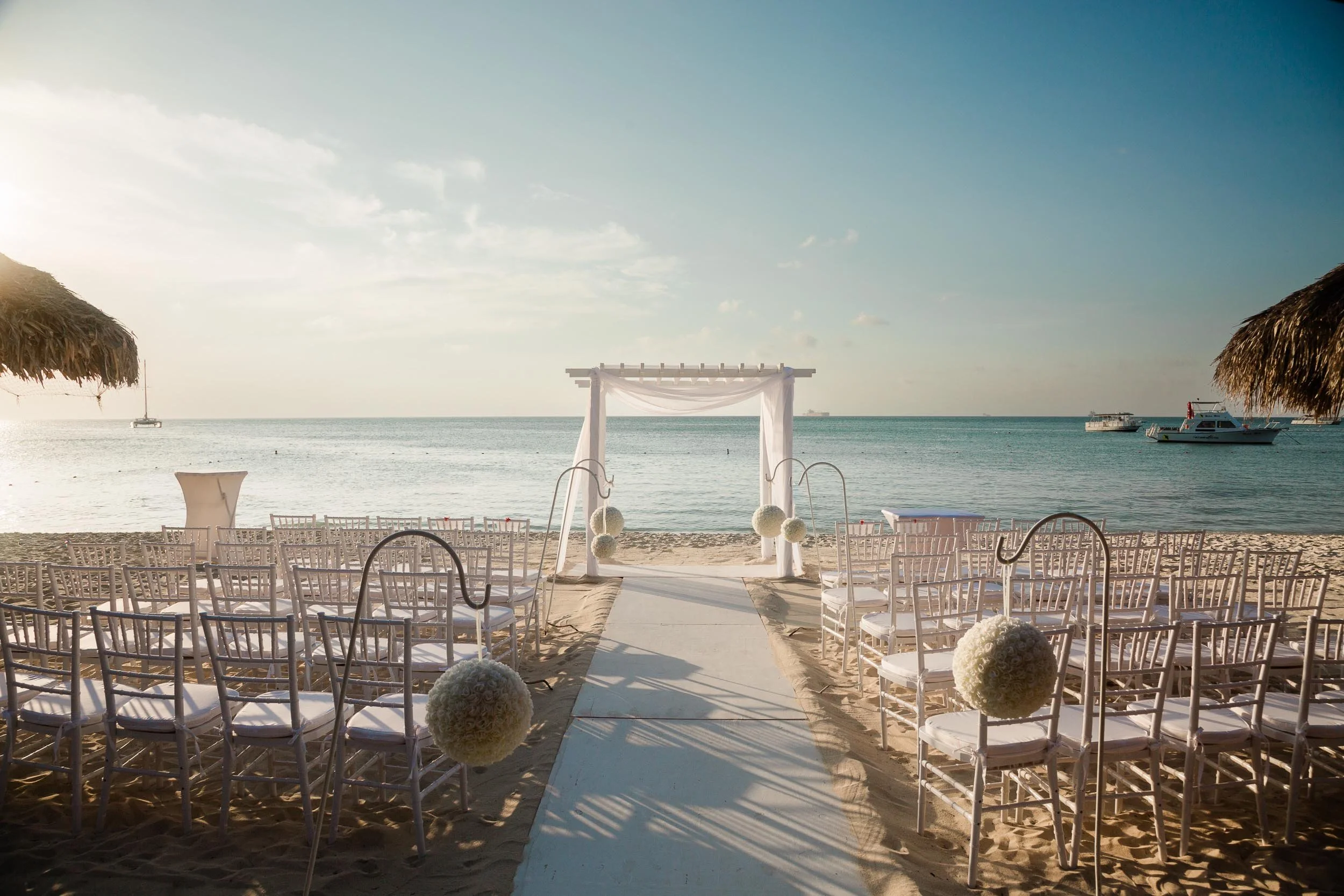 Beach wedding ceremony at sunset on Palm Beach Aruba