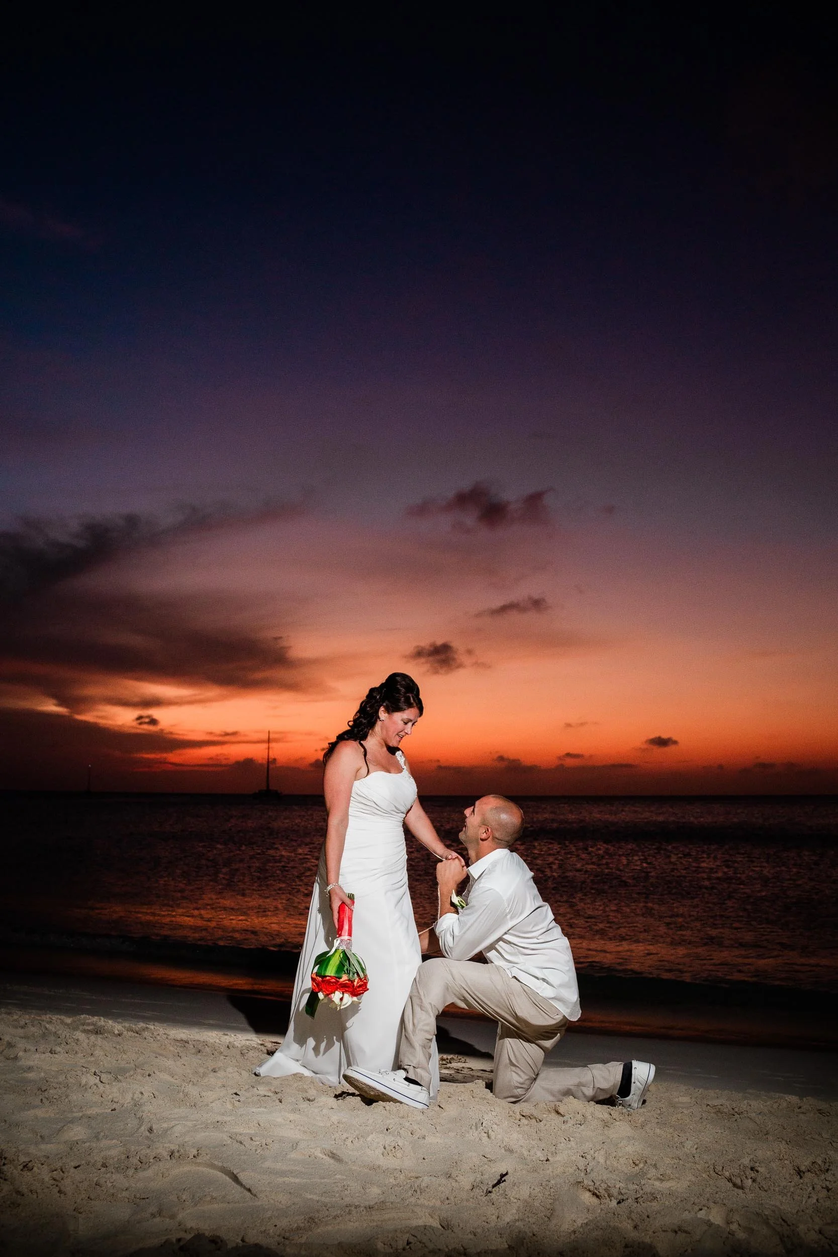 Bride and groom portrait at golden hour on Palm Beach Aruba