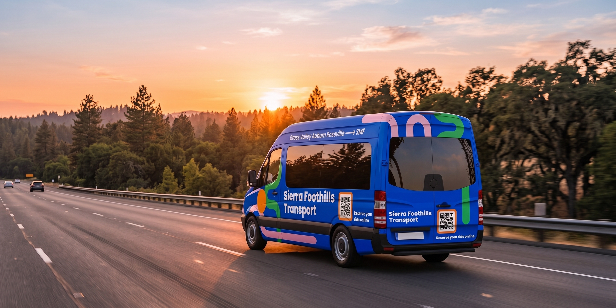 A blue Sierra Foothills Transport van traveling on a highway at sunset, with trees and a colorful sky in the background.