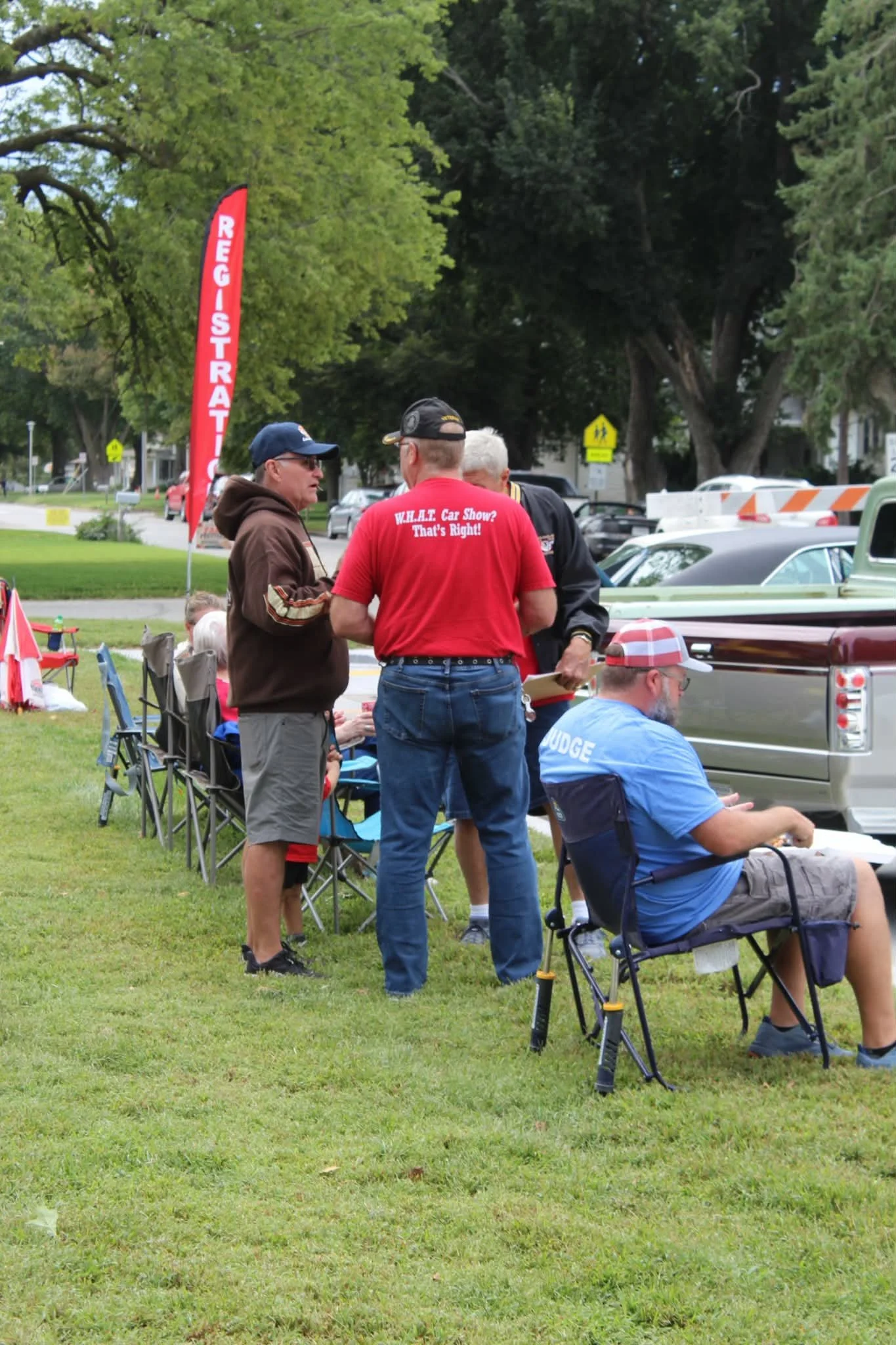 WHAT Foundation president Alan O'Sullivan talking with fellow WHAT Team member, Corey Feil.

Shot by our own Wahoo resident, Angiee Dey