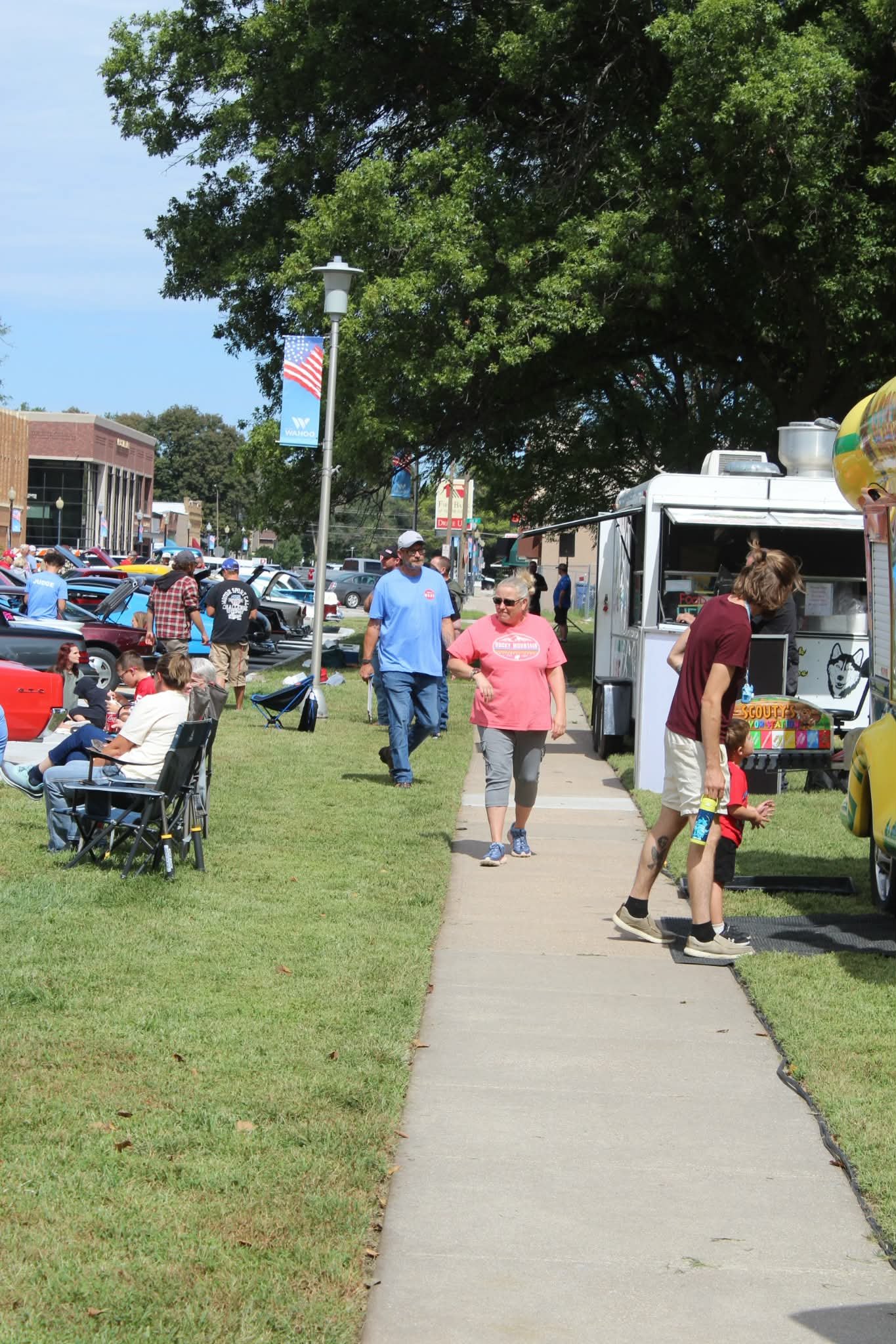 Team members Robert & Heather Malina checking out all the cars and having fun! 

Shot by our own Wahoo resident, Angiee Dey