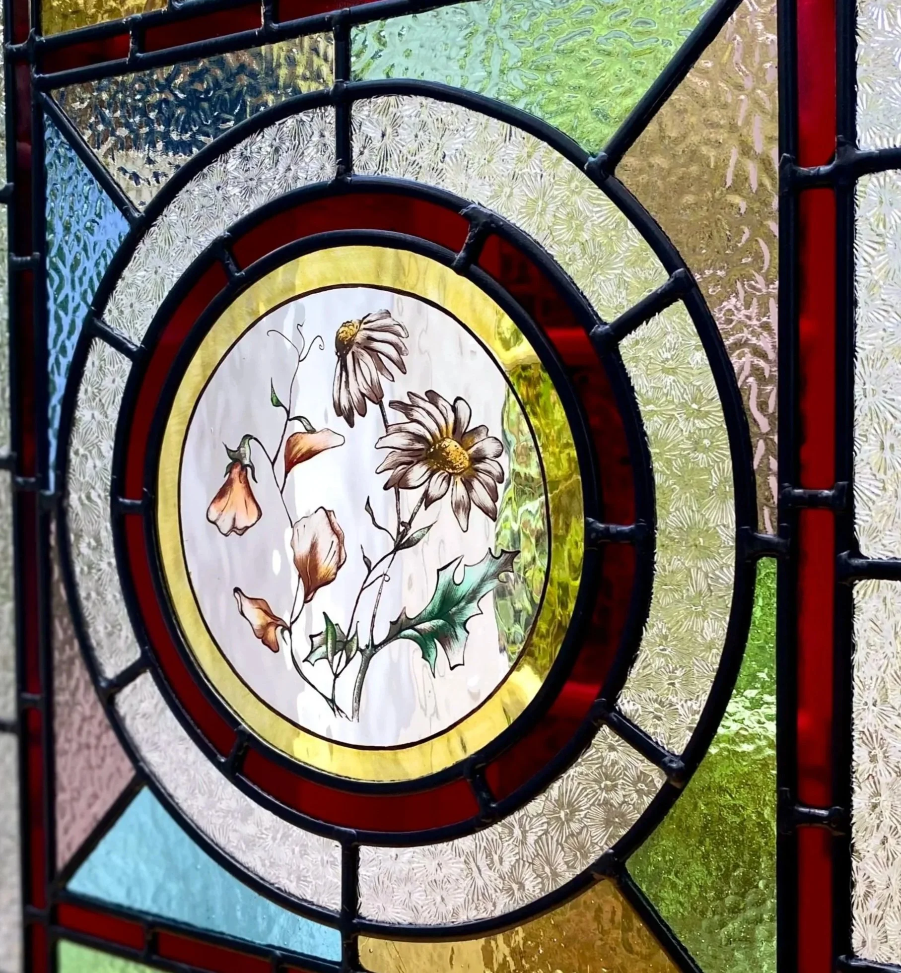 birth flower daisy and sweetpea roundel by glass artist zoe henderson