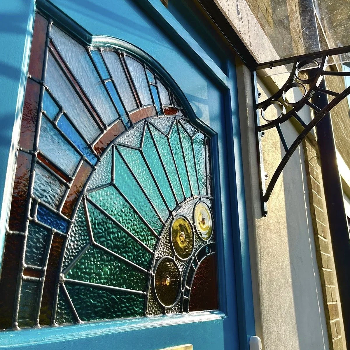 Best stained glass in london Colourful stained glass leaded panel with playful interpretation of the classic sunburst design.  designed and built by Zoe Henderson Polatch