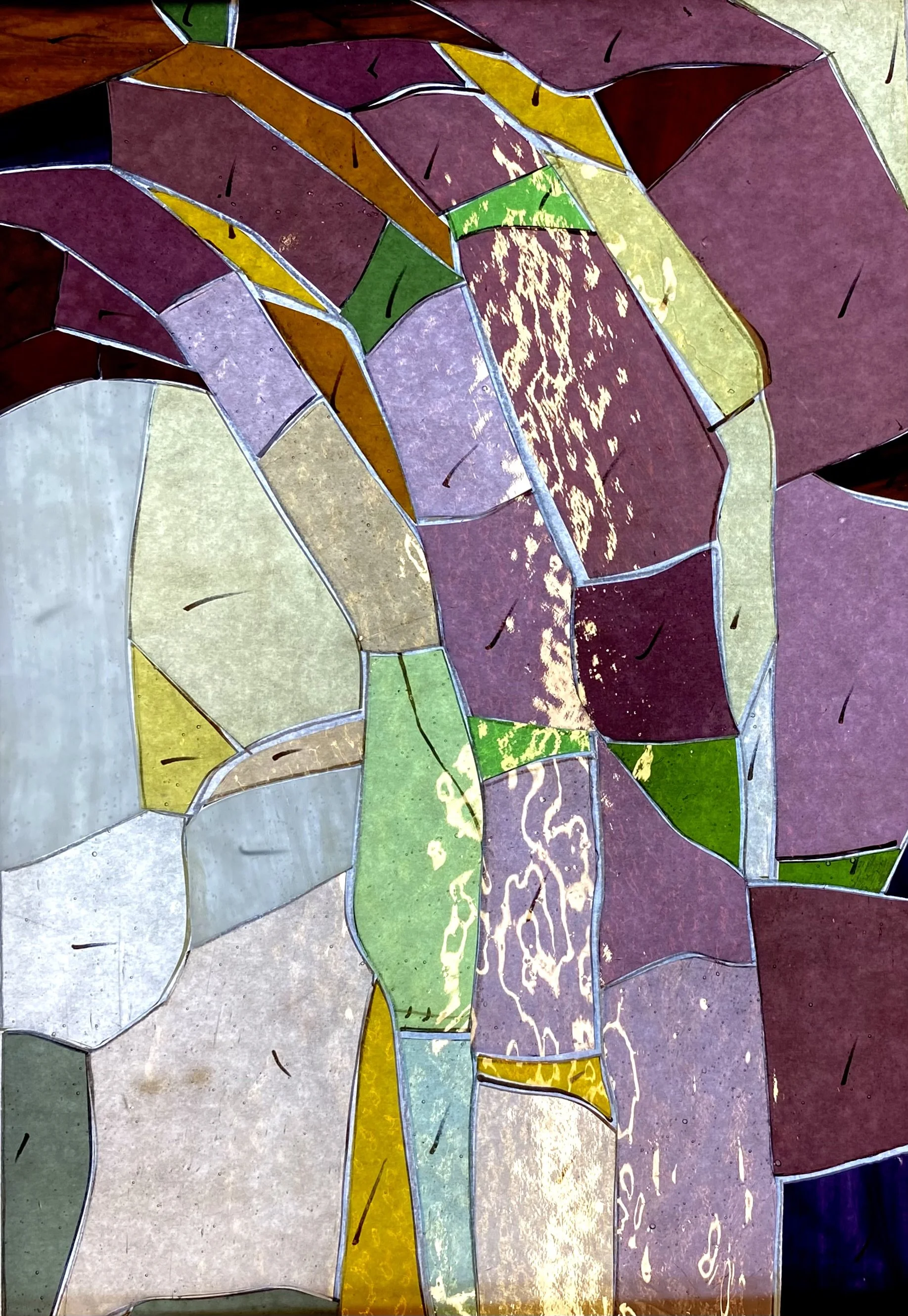 Colorful stained glass window with abstract design of variously shaped glass pieces in shades of purple, green, yellow, beige, and white