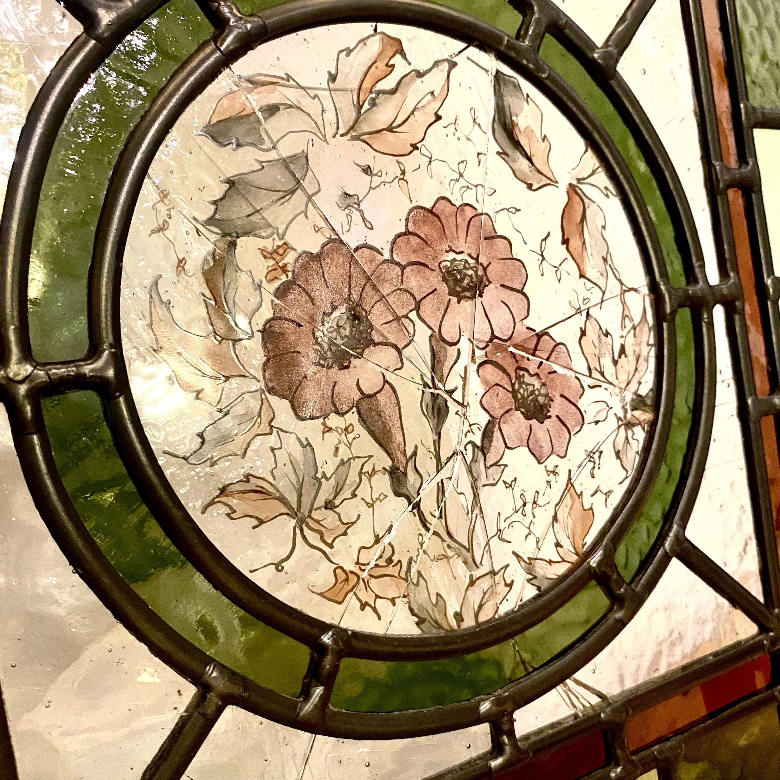 broken hand painted glass roundel central feature restored by Zoe Henderson