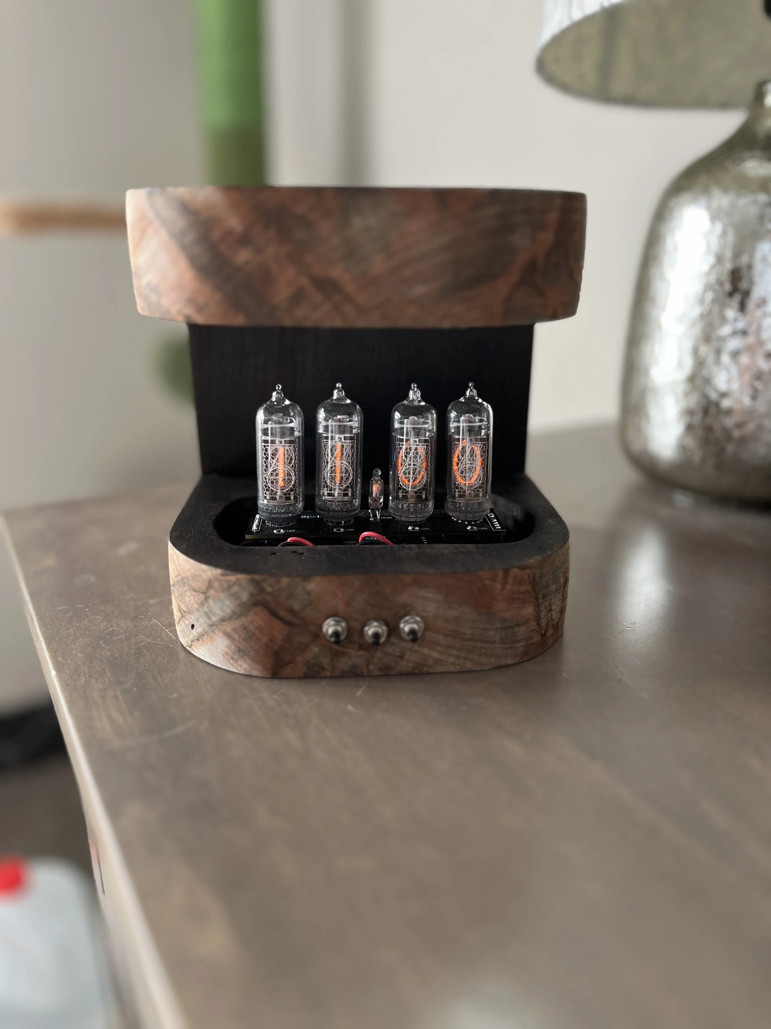 Nixie tube clock and charger