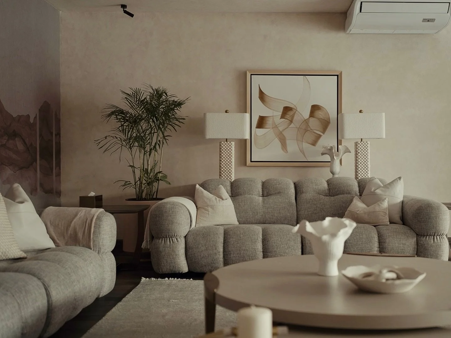 A family lounge where days soften and conversations linger.

A quiet composition of texture, tone, and form, anchored by an abstract mural.

Travertine walls and ceiling @rockshieldpakistan 
Mural by @wallmasterpk @coordonne 
Designed by @2435design
