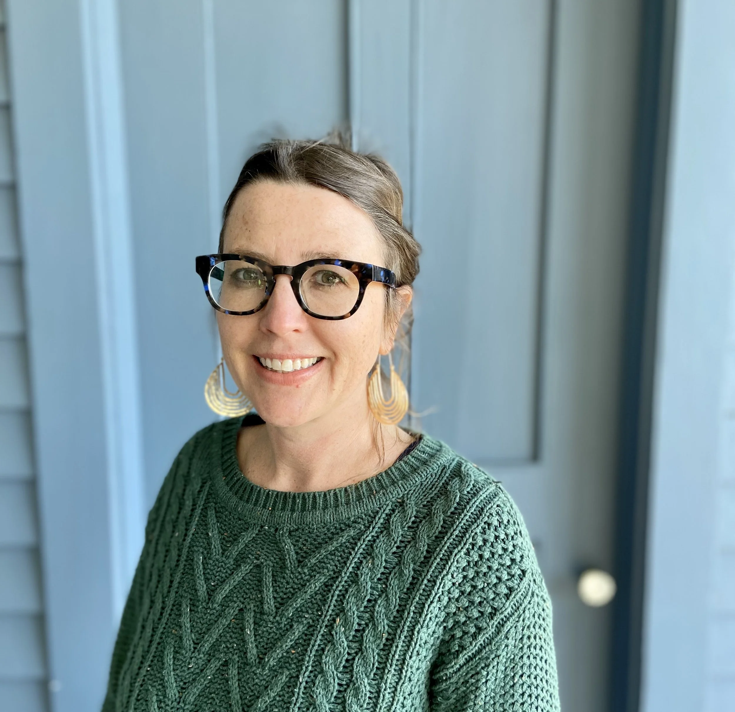 Therapist in front of blue background