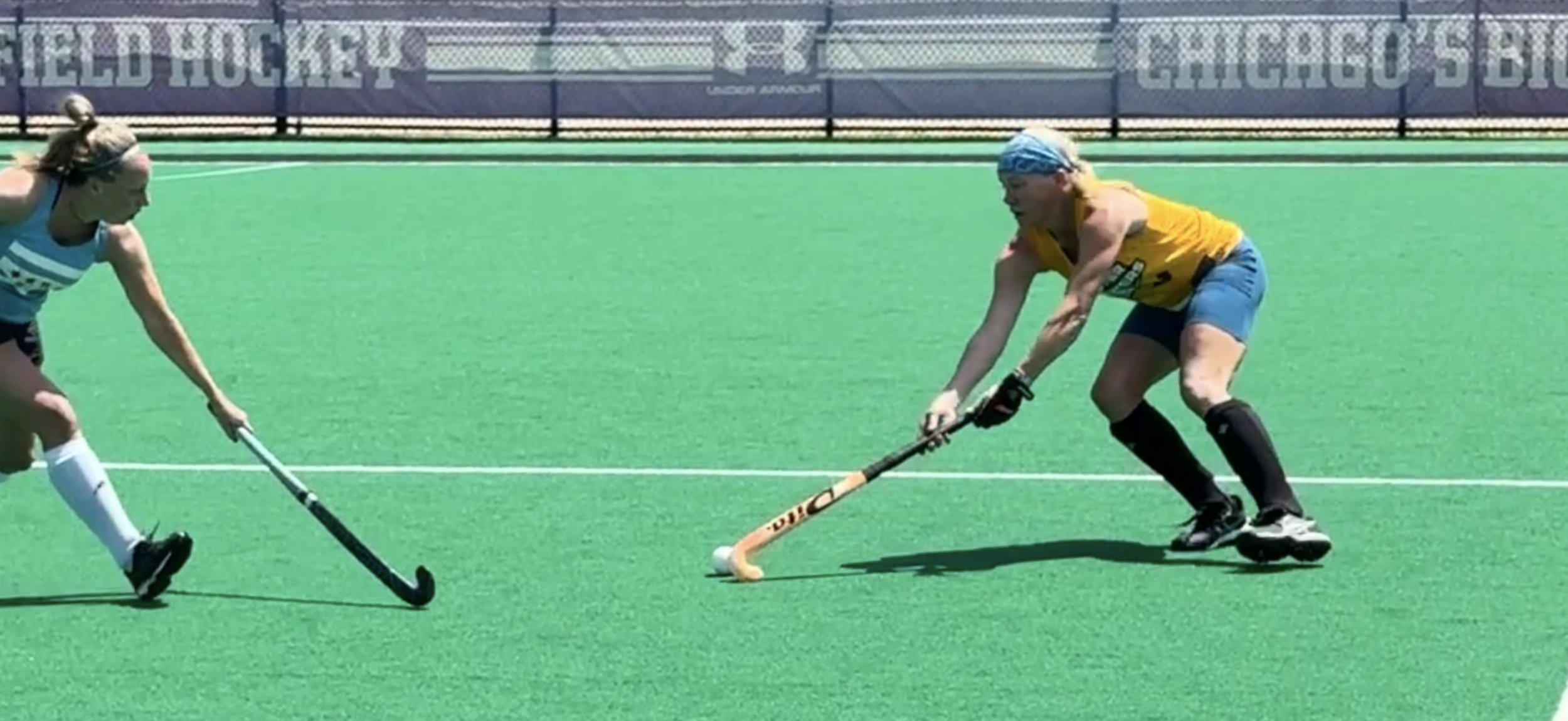 Gracie Cole playing field hockey in Chicago on an outdoor turf field, training in a tournament for the USA masters national field hockey team in preparation for the 2026 Masters World Cup