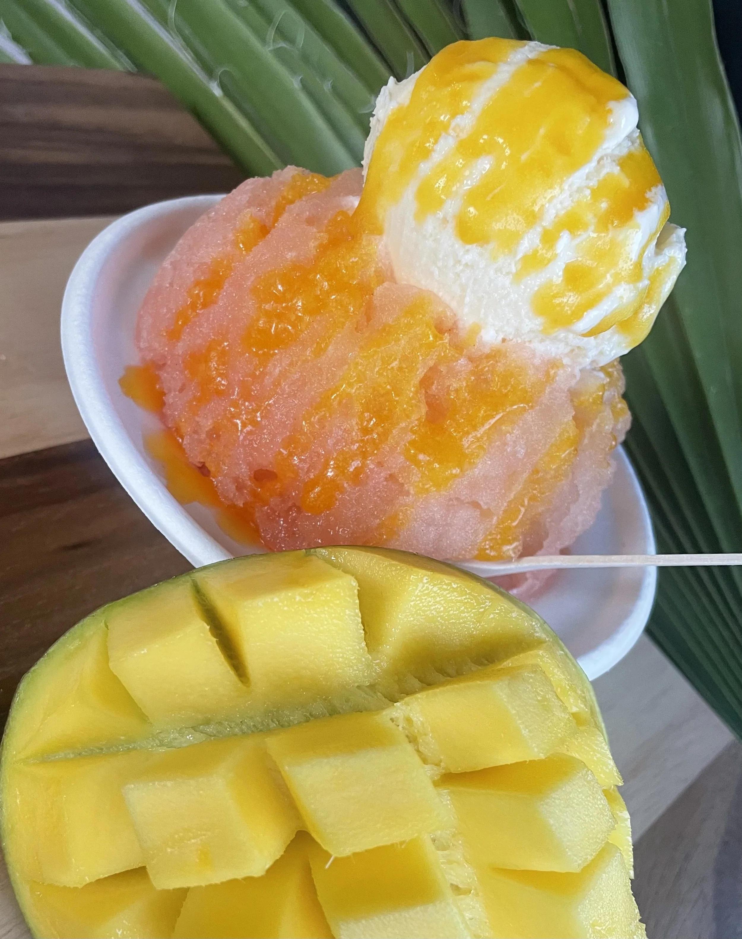 Signature "Mauna Kea " shave ice Made With Fresh P.O.G syrups,Vanilla or Haupia ice cream, Topped with Our Signature Mango Butter Drizzle