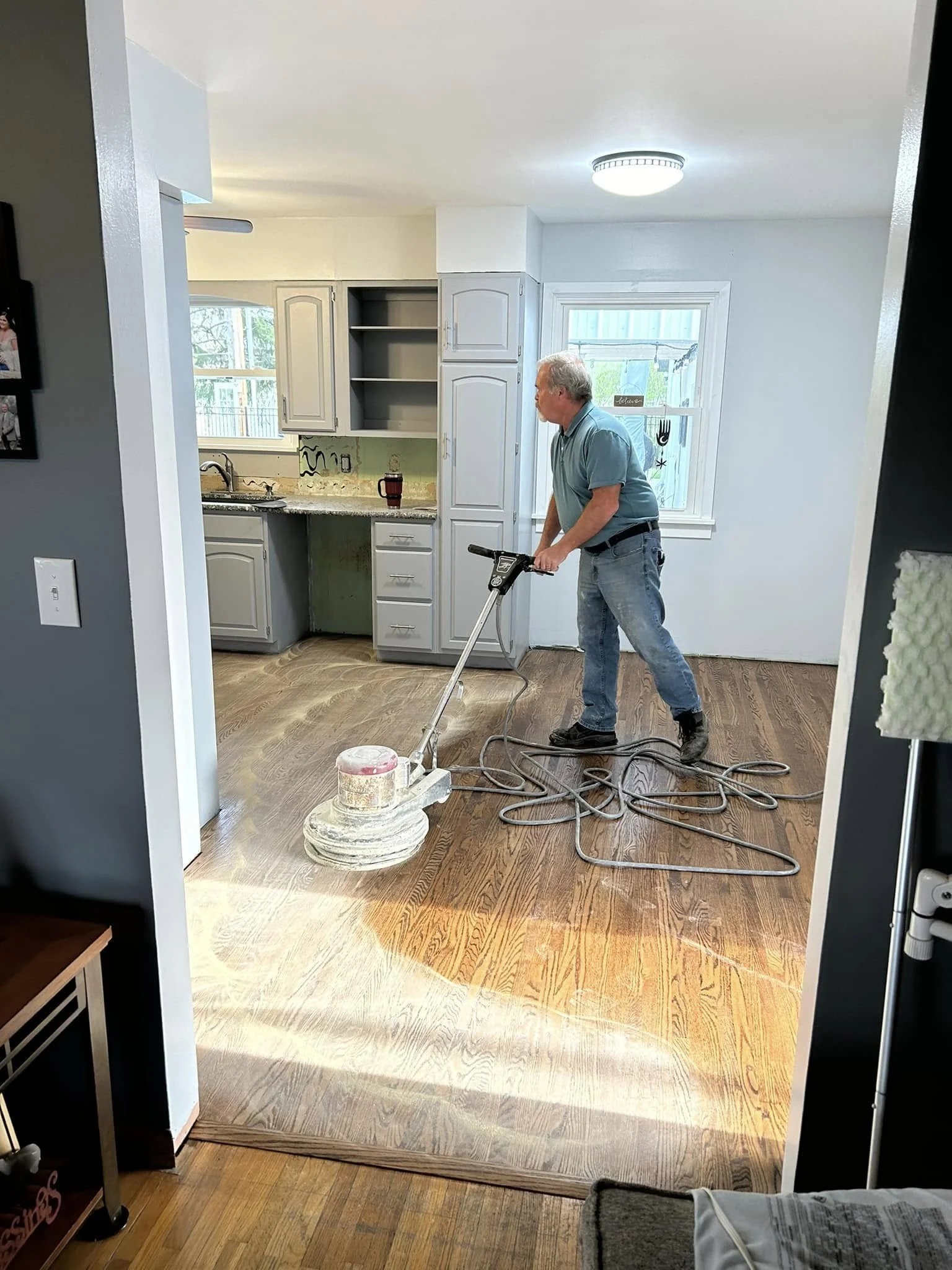 Mark Niese sanding a residential floor