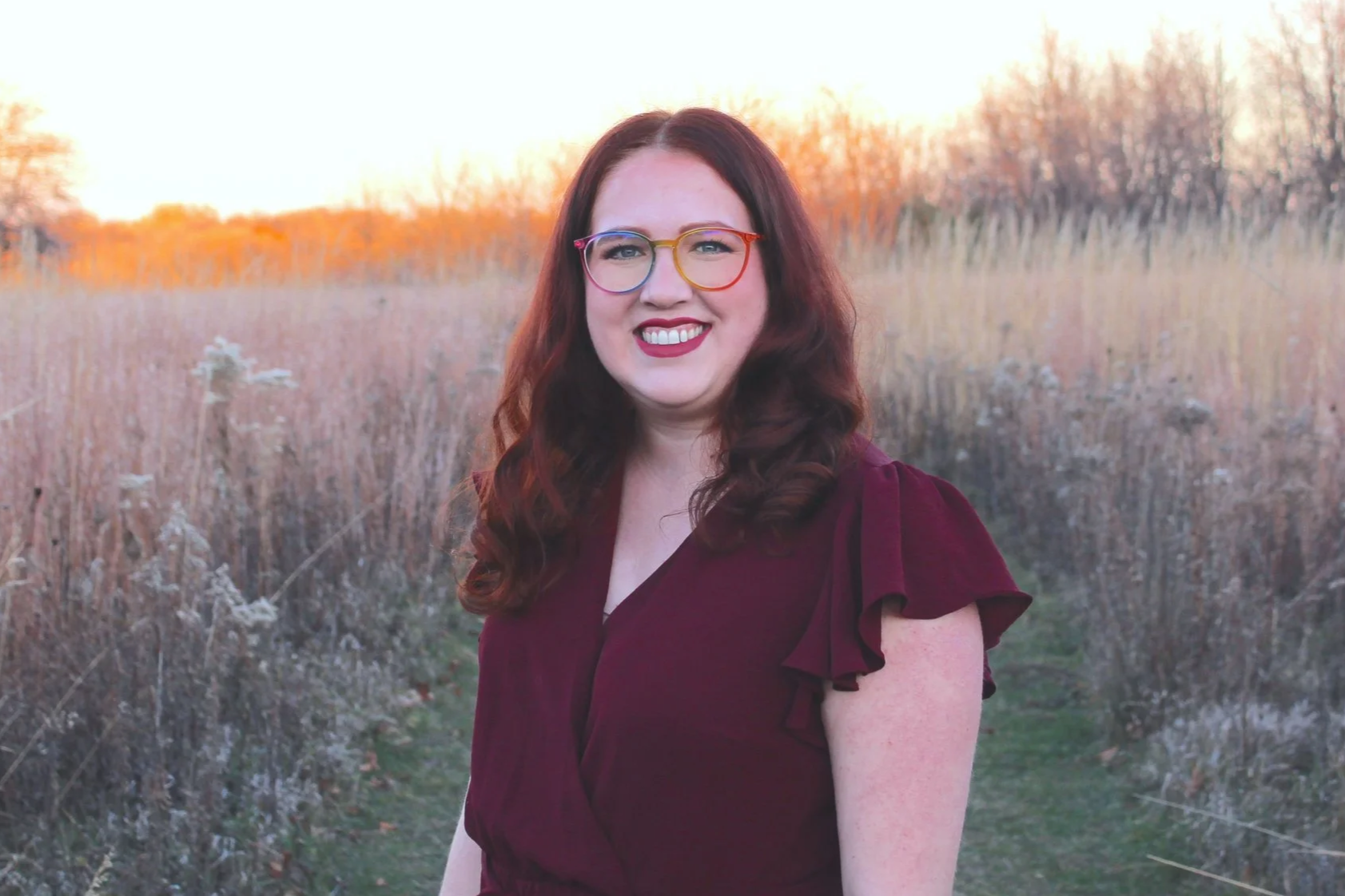 woman in a prairie at sunset